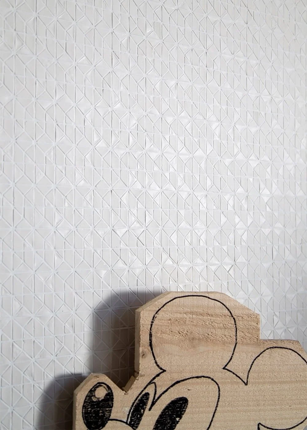 White recycled glass mosaic tile geometric textured surface modern architectural wall