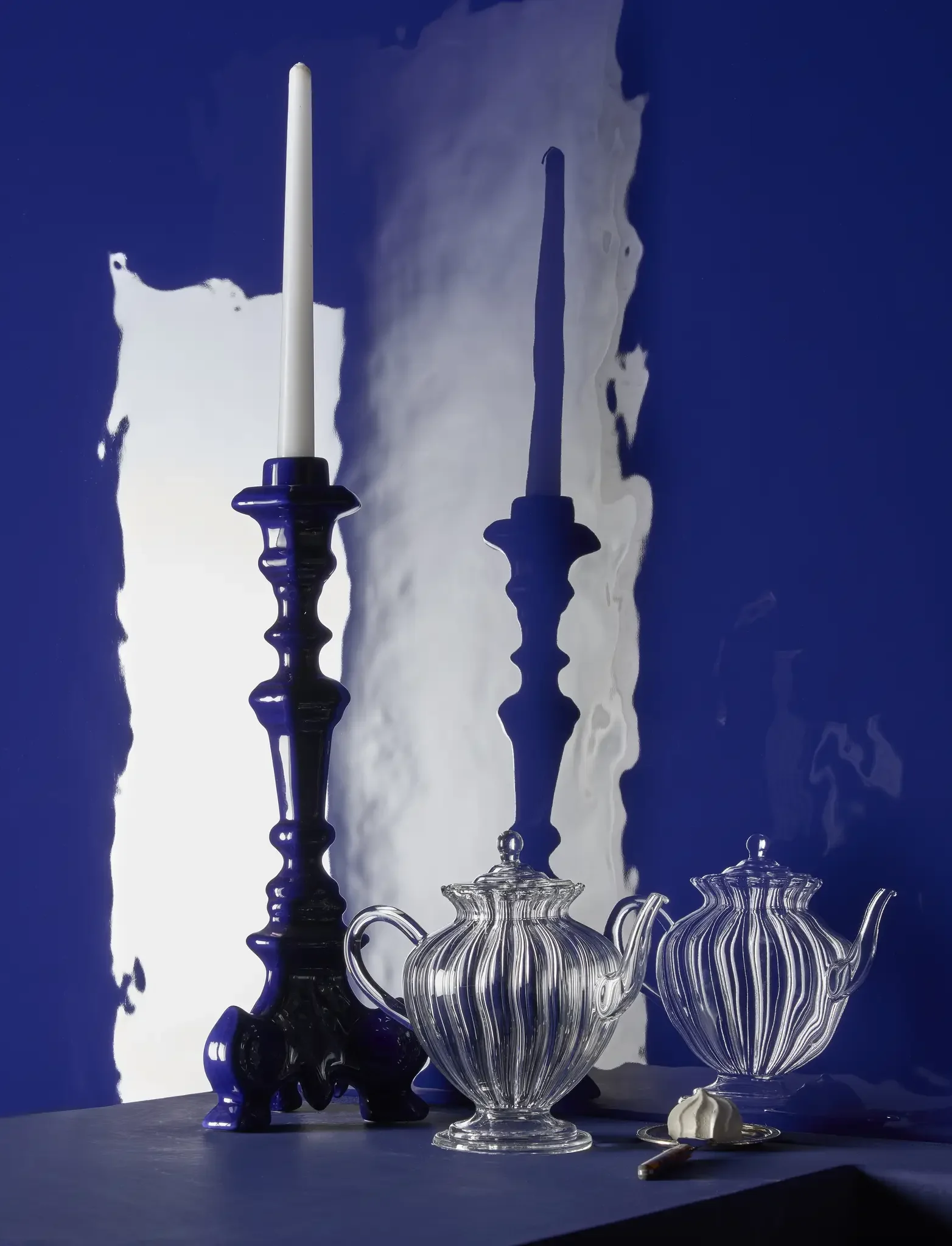 L'Eau Klein glossy porcelain tile with reflective blue glaze and rippling water-inspired texture
