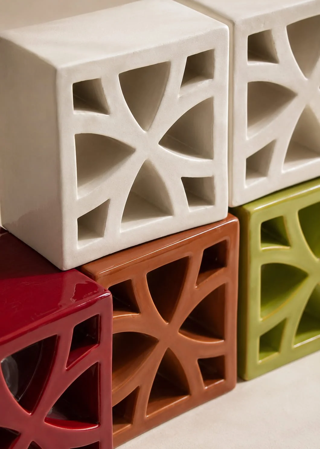 Split Blend Flo terracotta breeze block installation with curved geometric pattern and filtered natural light