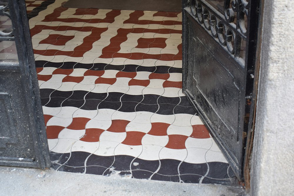 Terracotta and charcoal geometric patterned floor