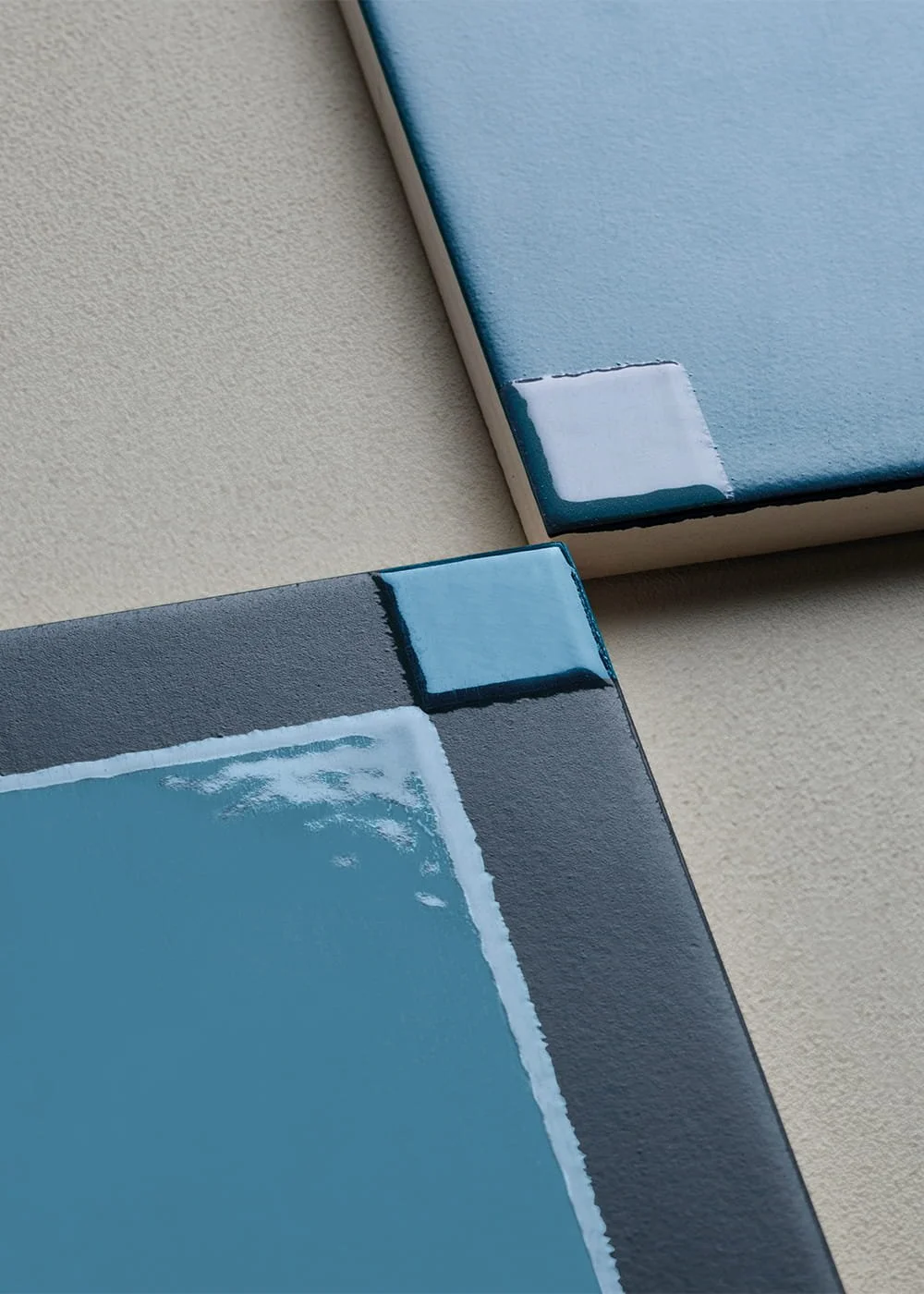 Glossy blue porcelain tile detail square format Josef Albers inspired surface
