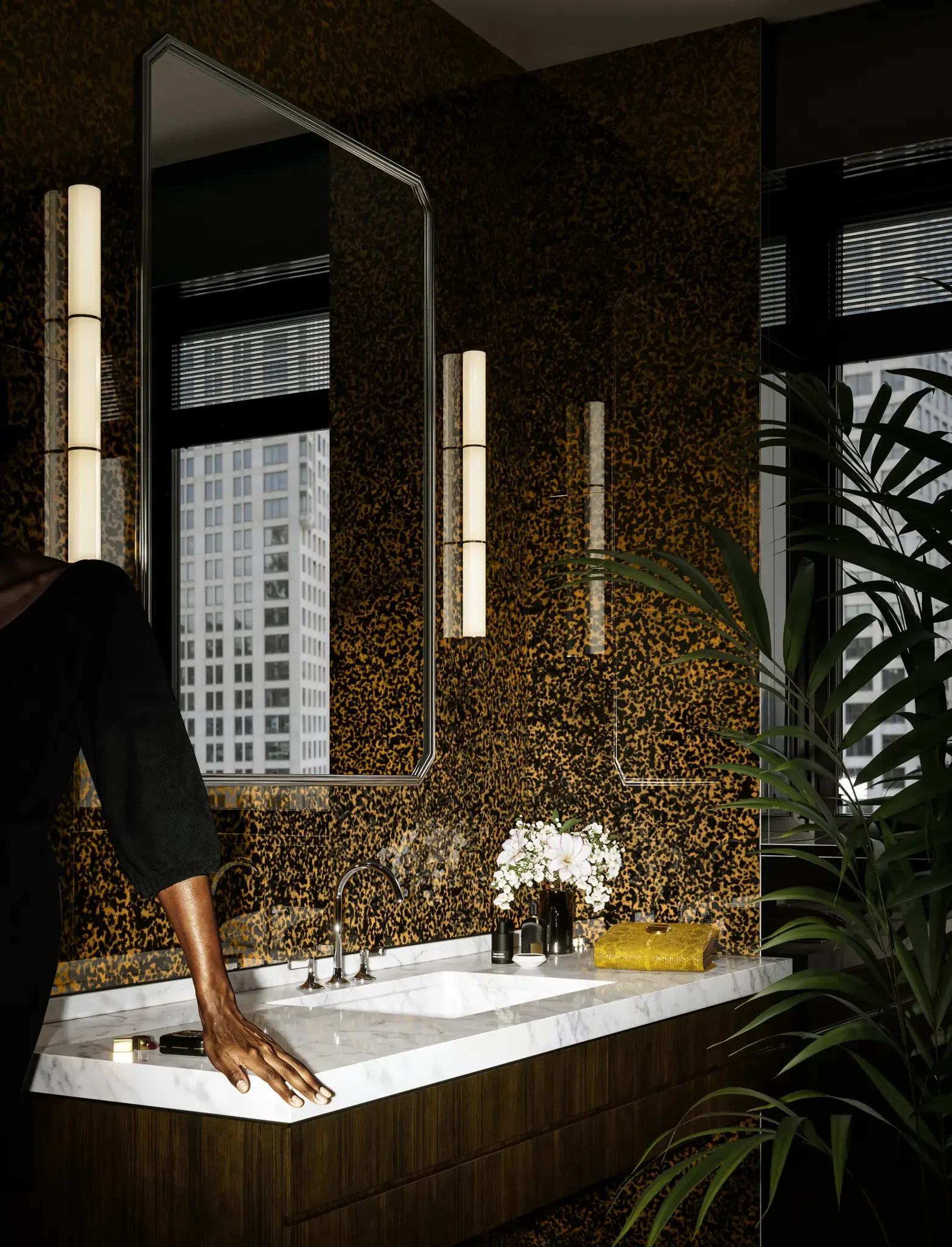 Tortuga glossy porcelain tile with tortoiseshell-inspired patterning in rich amber, caramel, and deep brown tones