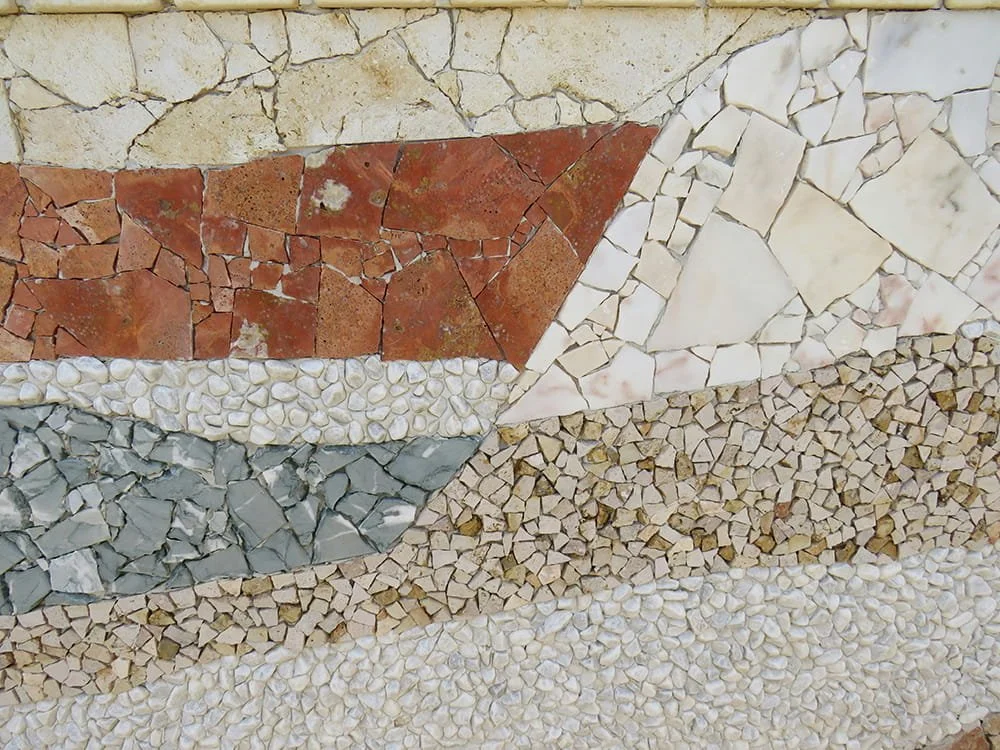 Natural stone mosaic textured wall surface for luxury residential and hospitality interiors