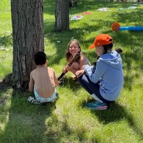 Kids climbing, running and playing outdoors at Camp Move Your Mood summer camp near Calgary, Alberta, led by physiotherapists and educators
