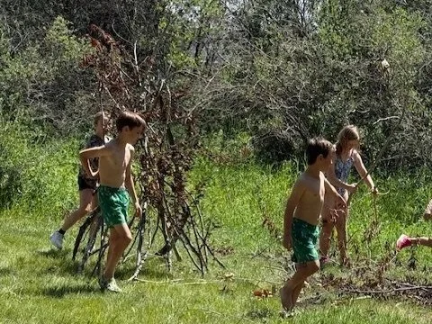 Camp Move Your Mood campers building teamwork skills through movement activities at Restorative Whole Health's summer camp in Okotoks