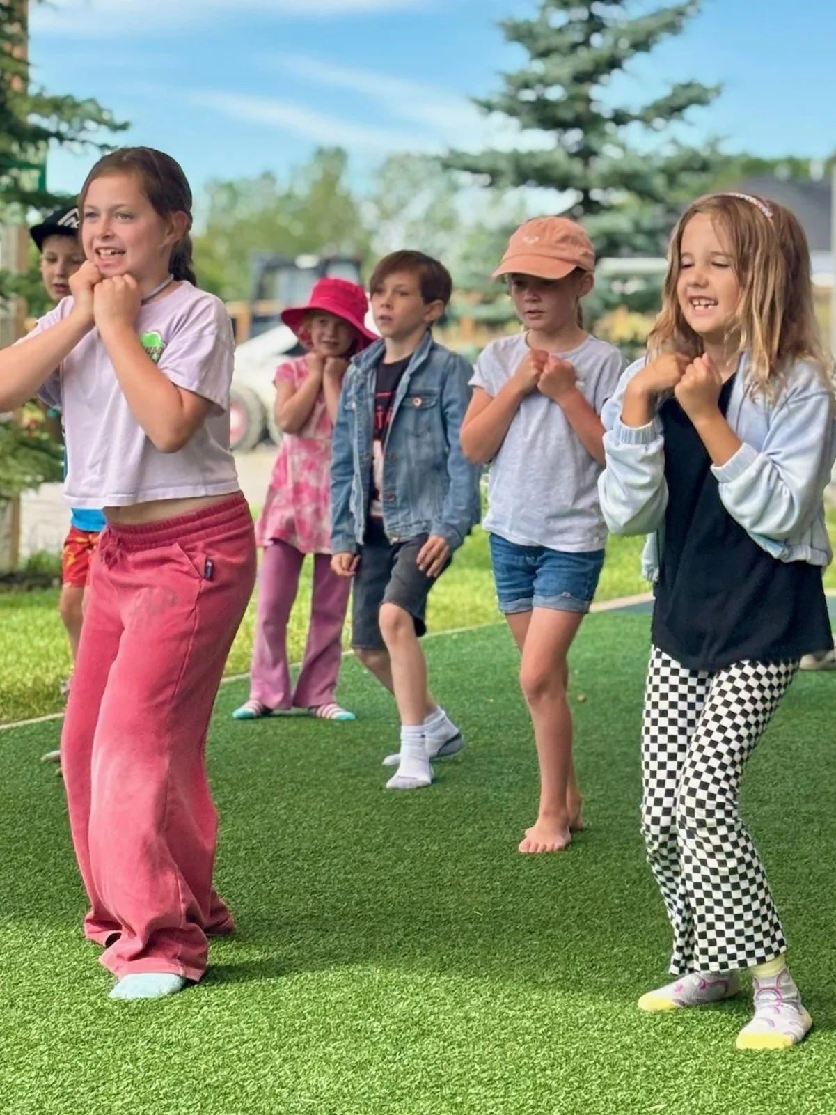 A group of campers participating in a group sport being led by camp counsellors
