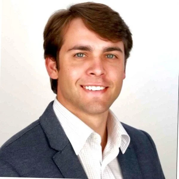 A blank, gray placeholder silhouette of a person on a light gray background.