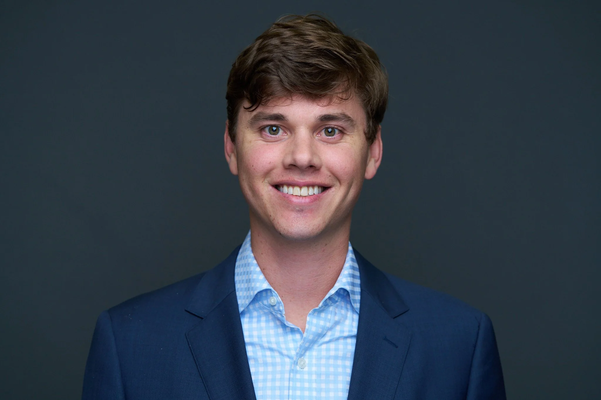 A silhouette of a person's head and shoulders against a light background.