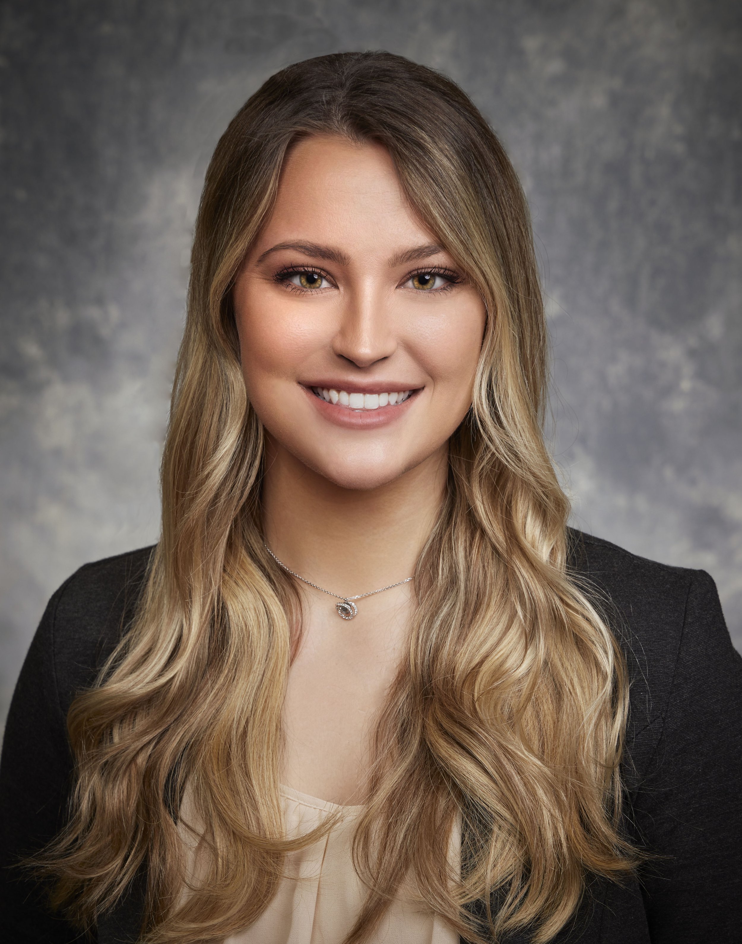 A blank, gray silhouette placeholder for an image of a person