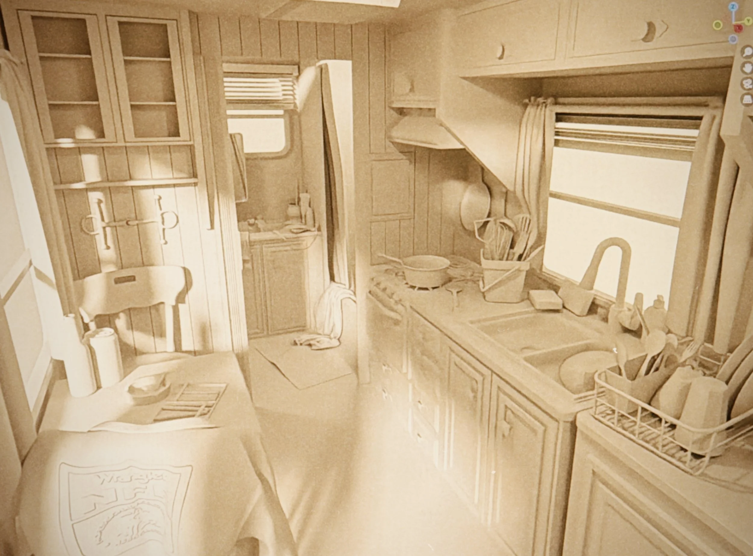 A small room with wooden furniture and decor, including a bookcase, a window with curtains, a small table, and a rocking chair, all in a light wood finish.