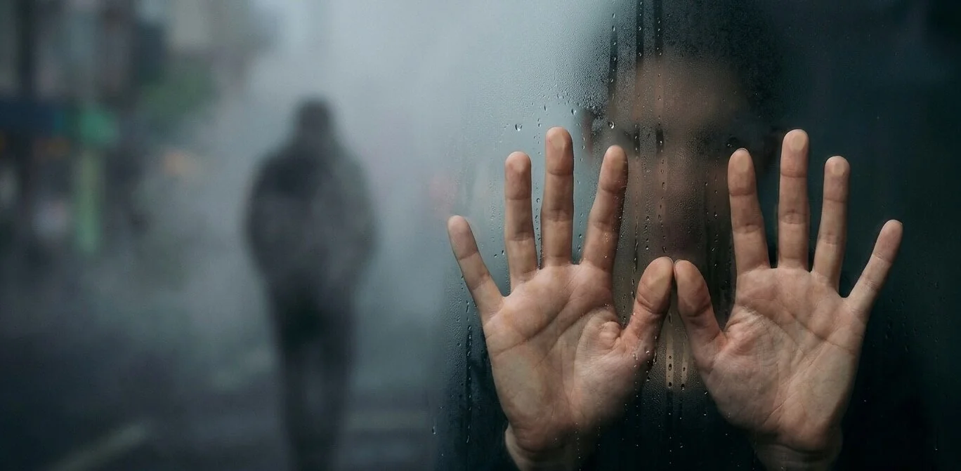Abstract image representing the invisible weight of unresolved childhood trauma Style: Conceptual, soft focus, muted blues and greys