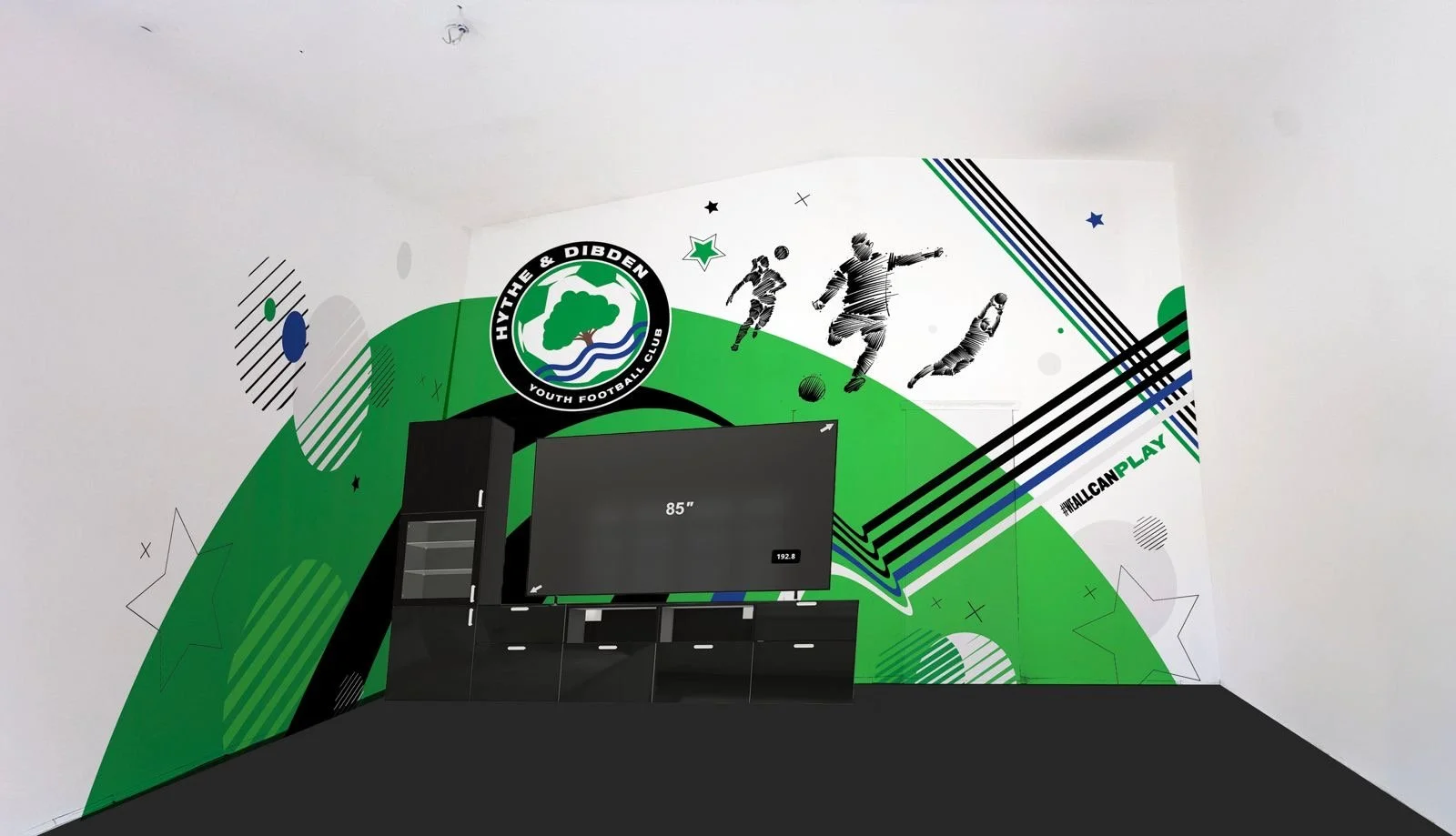 Interior of a room with a large football-themed mural featuring the Hythe & Dibden Youth Football Club logo, silhouettes of football players, a widescreen TV, and a black cabinet.