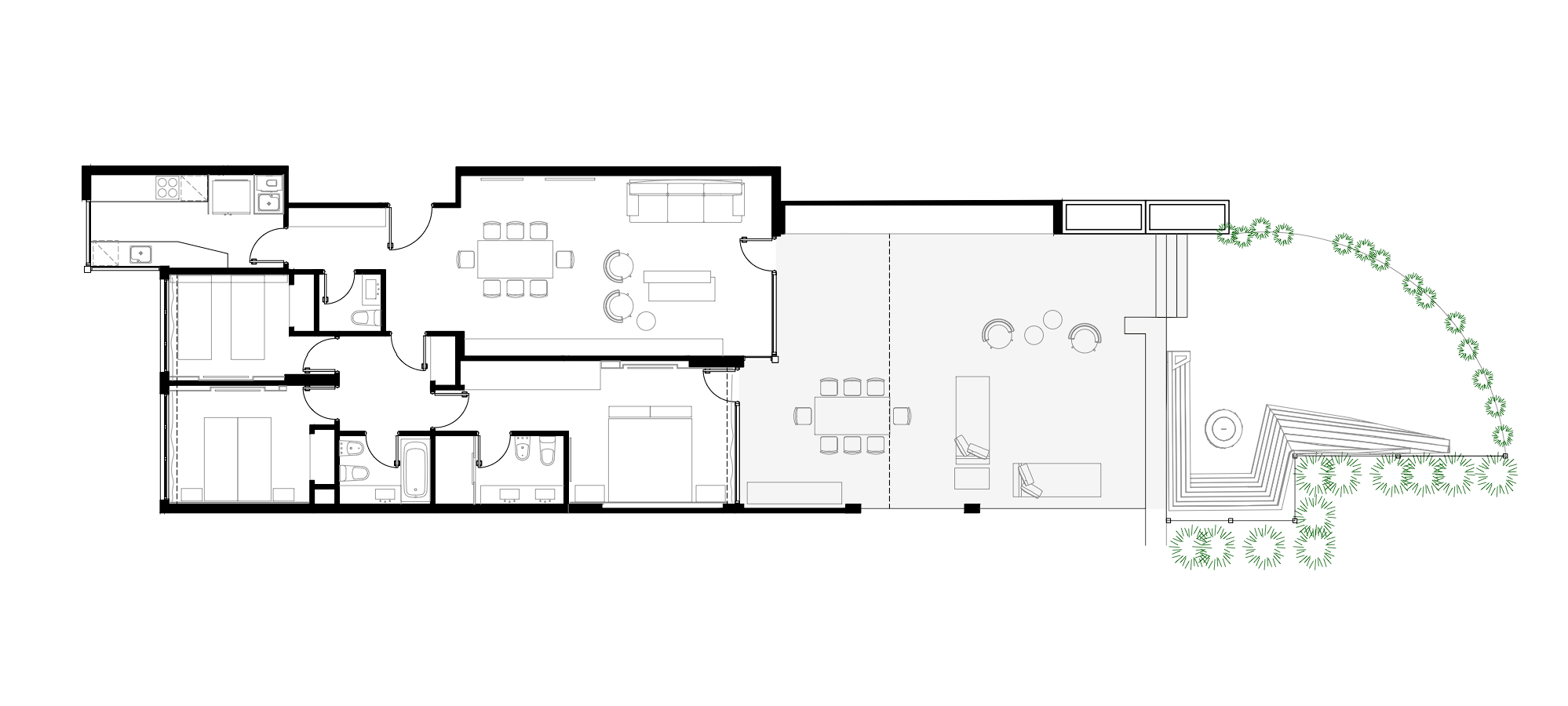 Plano arquitectónico de una casa residencial con jardines y áreas exteriores.