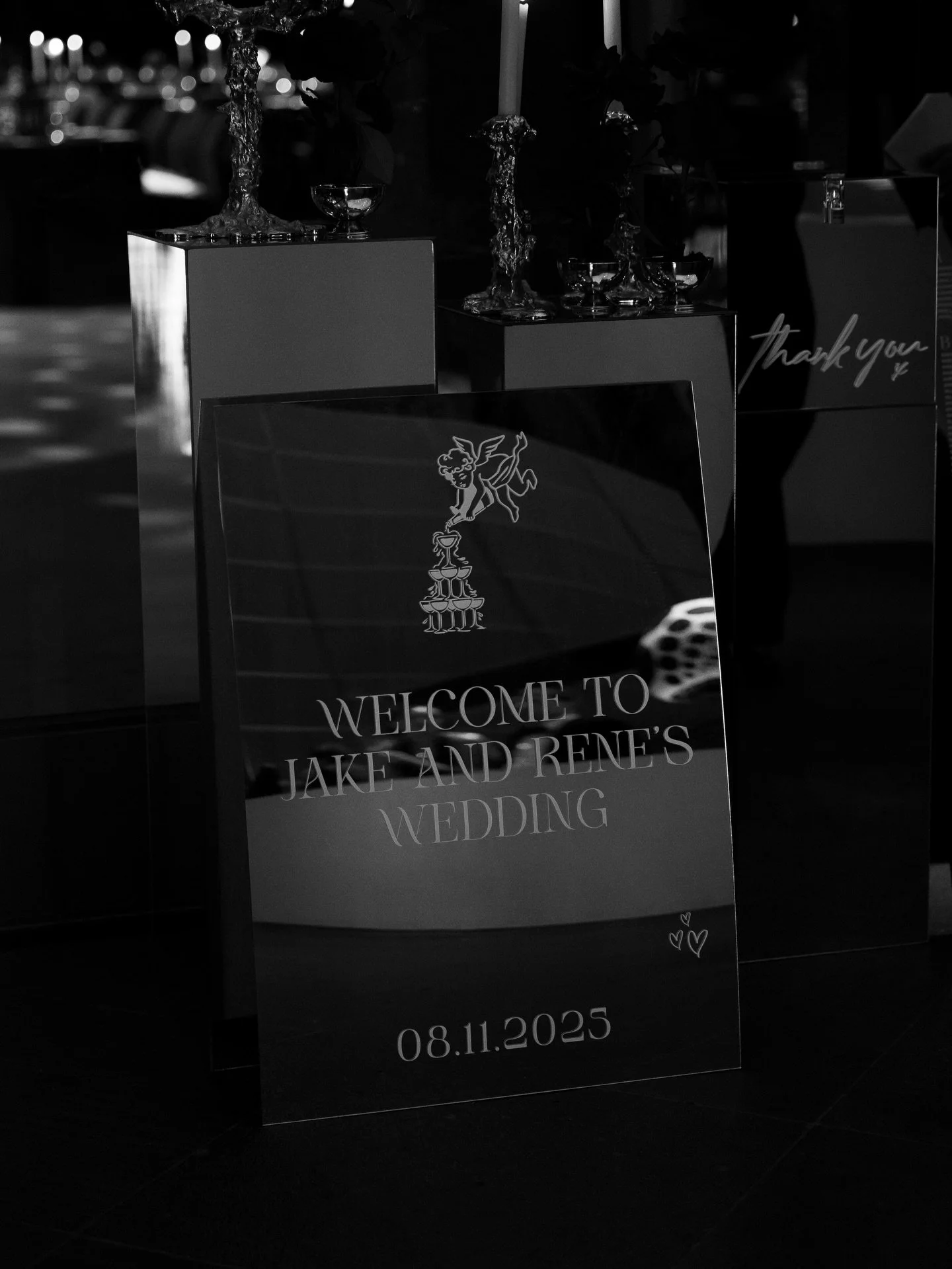 The wedding of Jake &amp; Rene.

Inspired by the space itself: rich reds, deep burgundies and silver mirrors set against the grand hall&rsquo;s stunning ceiling.

Hey Catheryn offered an on-brand welcome sign, seating chart, burgundy match boxes + mi