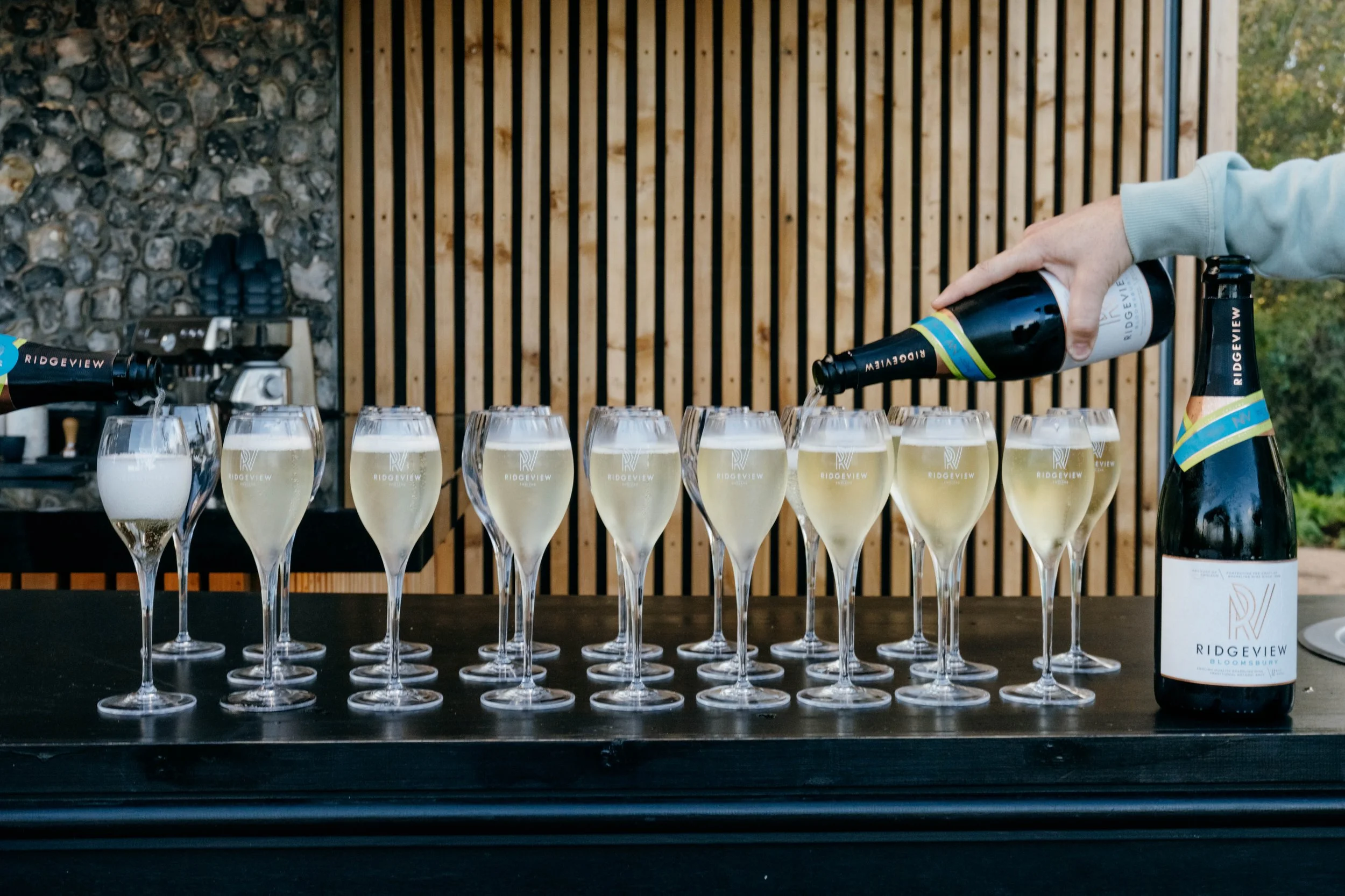 Glasses of English sparkling wine being poured
