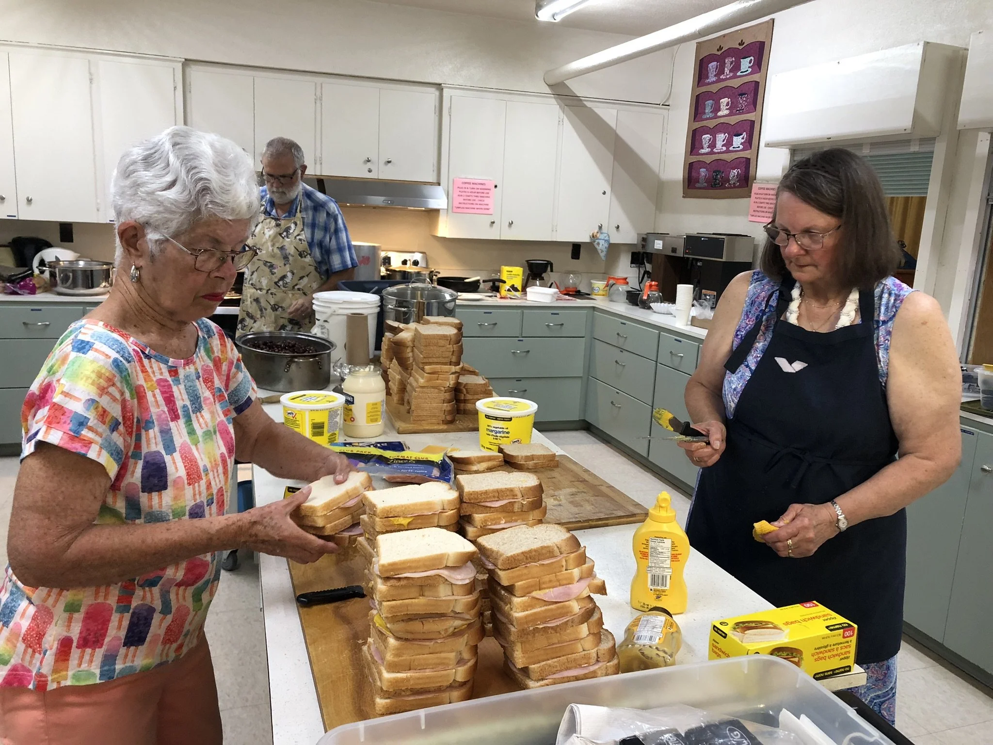 Lenore, Joe, Carol making sandwiches June 2025.JPEG