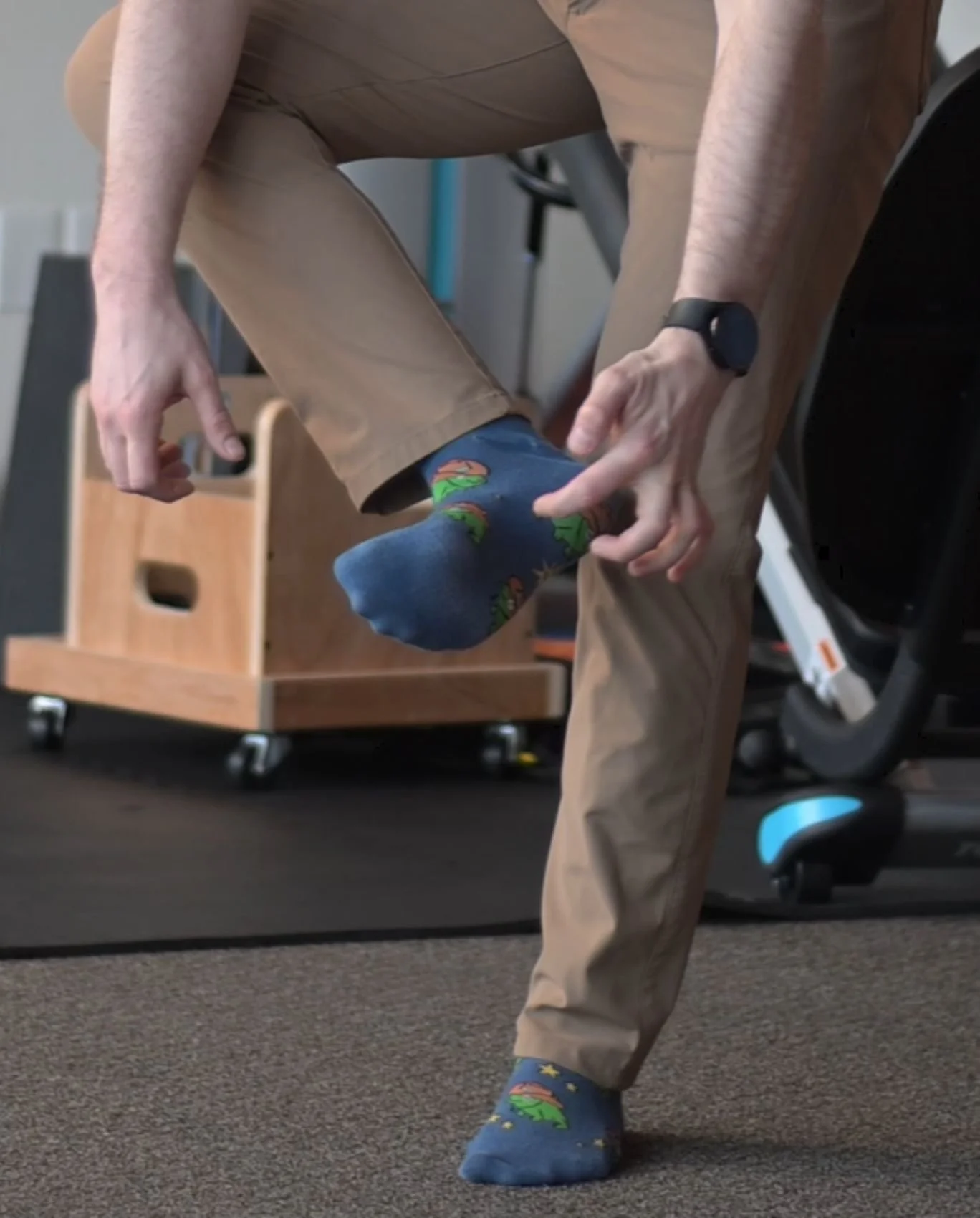 A physical therapist providing patient education about the foot tripod, which is essential for balance