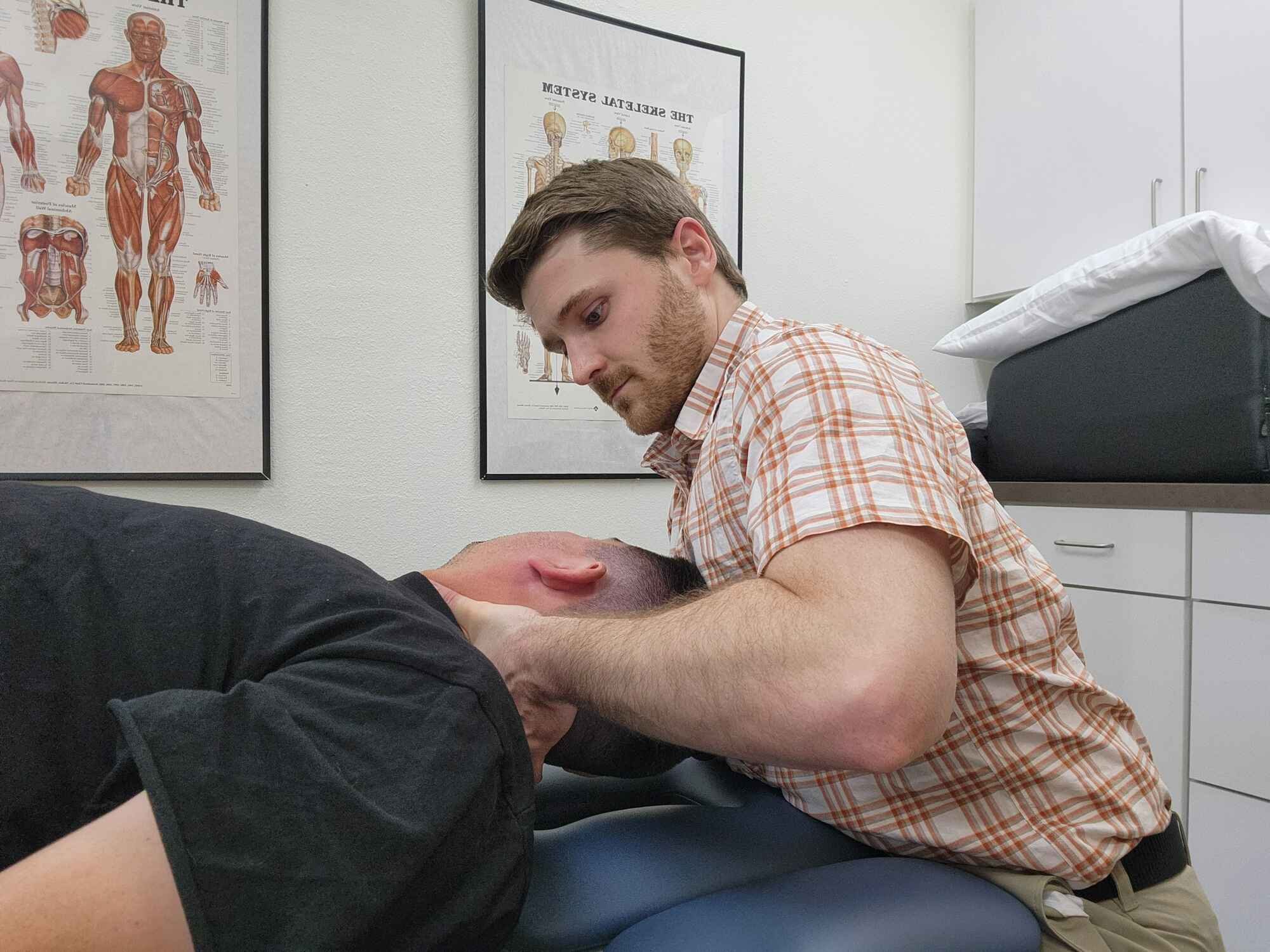 Physical therapist mobilizes a patient's neck to help reduce stiffness, neck pain and headaches at Tualatin Valley Physical Therapy in Hillsboro