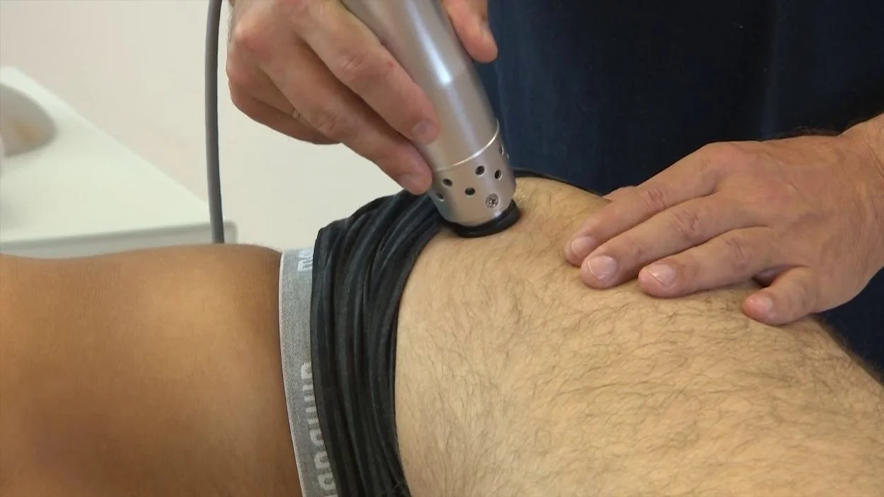 A photo of a patient receiving shockwave therapy treatment for gluteal tendinopathy in Hillsboro, OR