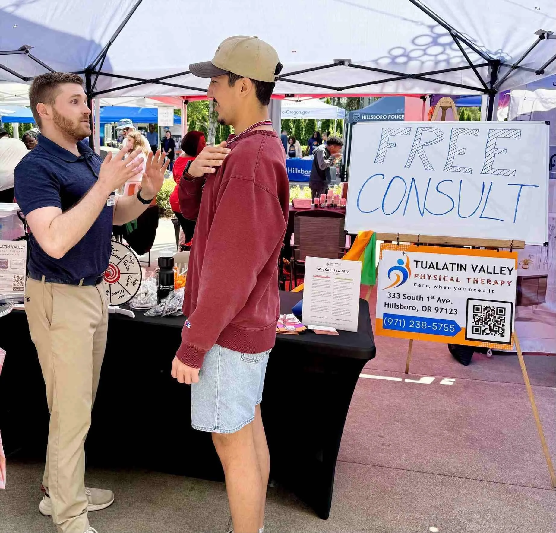 Dr. Ben explains what impairments may be present with shoulder pain and how to address them during a free consultation at an outdoor event.