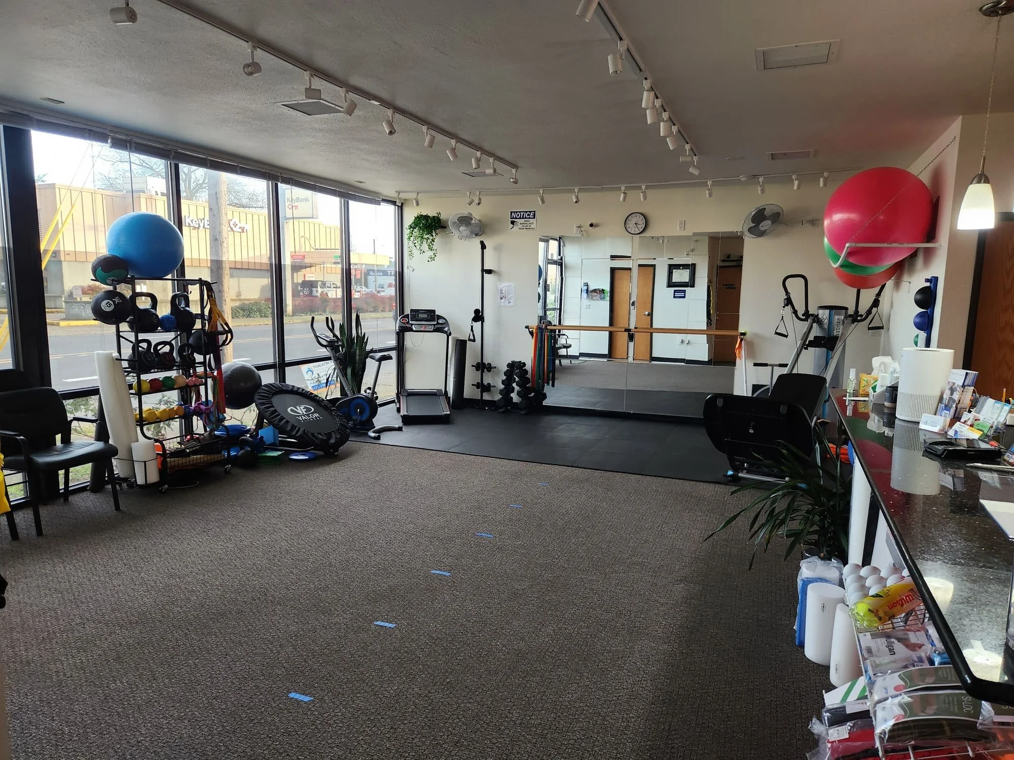 The inside of a physical therapy clinic with various equipment