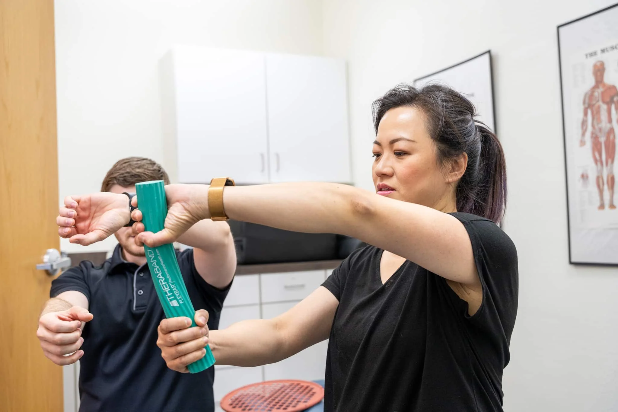 Physical therapist evaluating De Quervain’s tenosynovitis and treating thumb-side wrist pain in Hillsboro, Oregon
