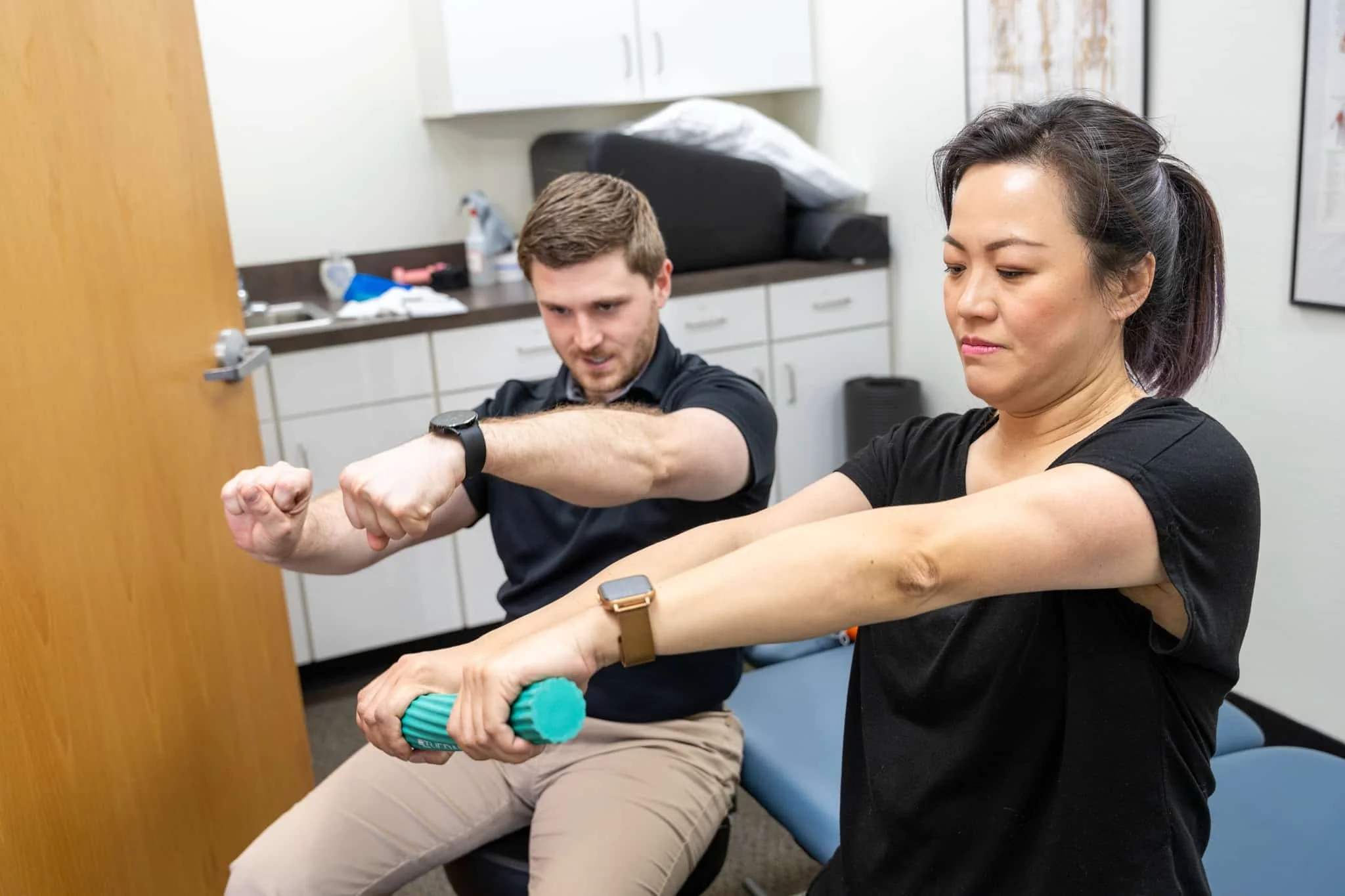 A physical therapist helps a patient restore their ability to move without pain