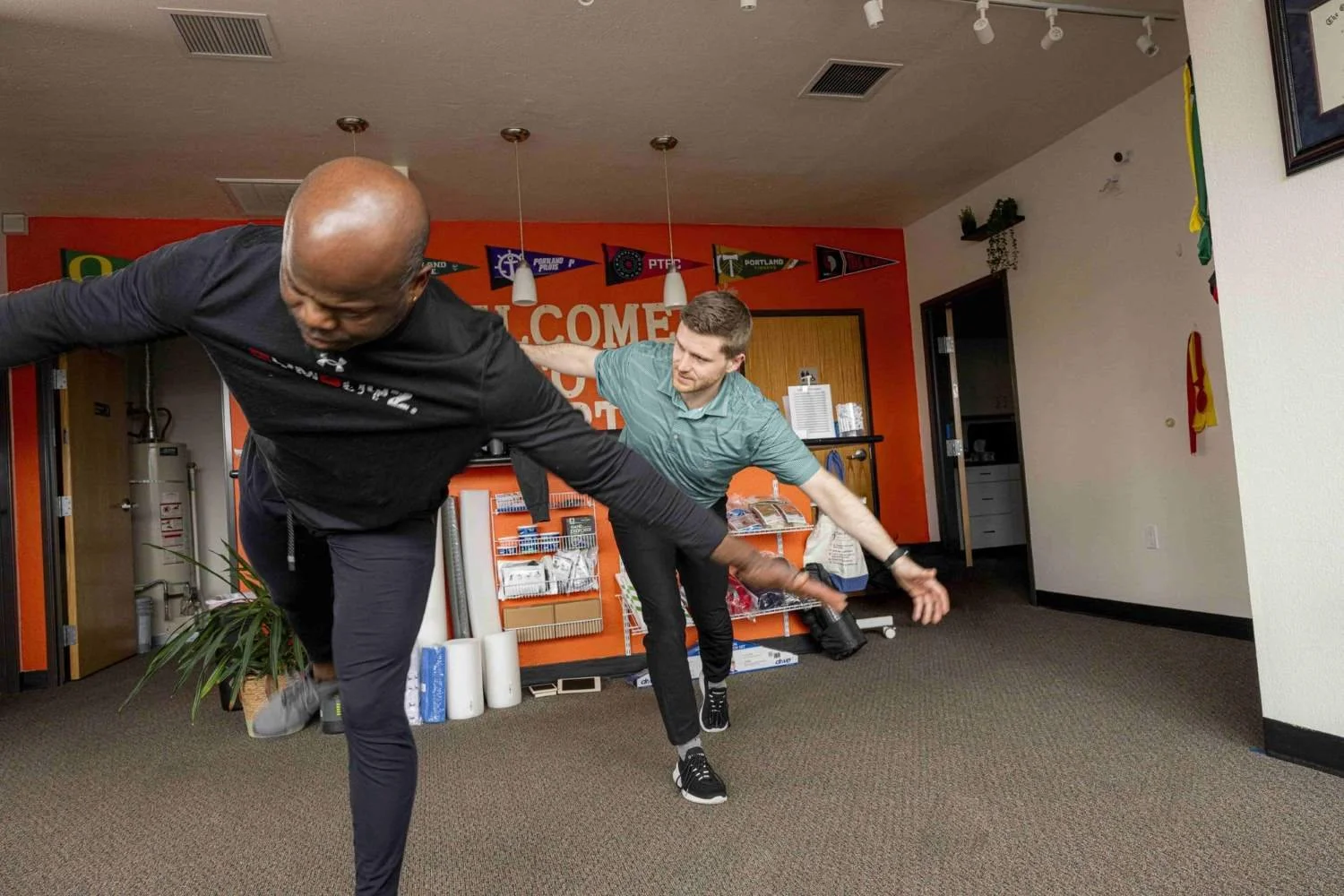 A physical therapist working on balance and fall prevention with a patient
