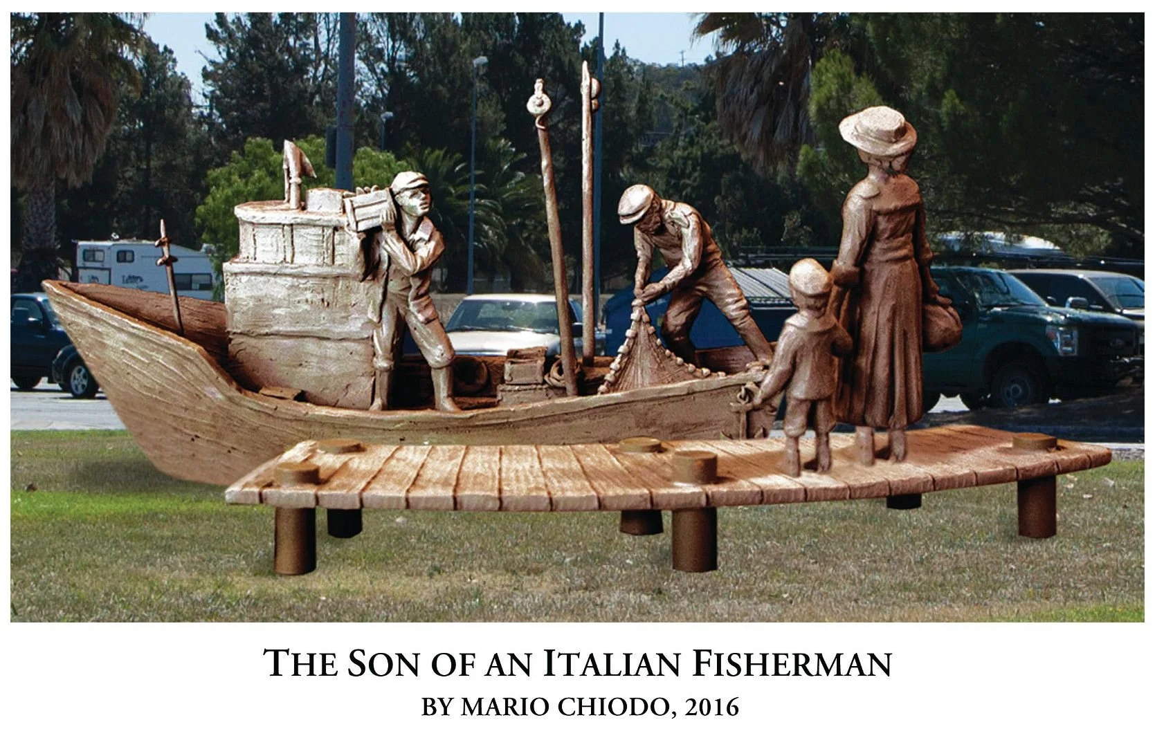 Wooden sculpture artwork titled 'The Son of an Italian Fisherman' by Mario Chiodo, 2016, depicting a family on a dock with a boat filled with fishing gear, and two fishermen working, with trees and parked cars in the background.