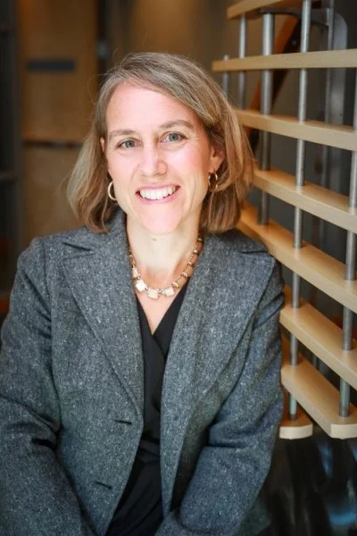 professional headshot of blonde woman with grey blazer