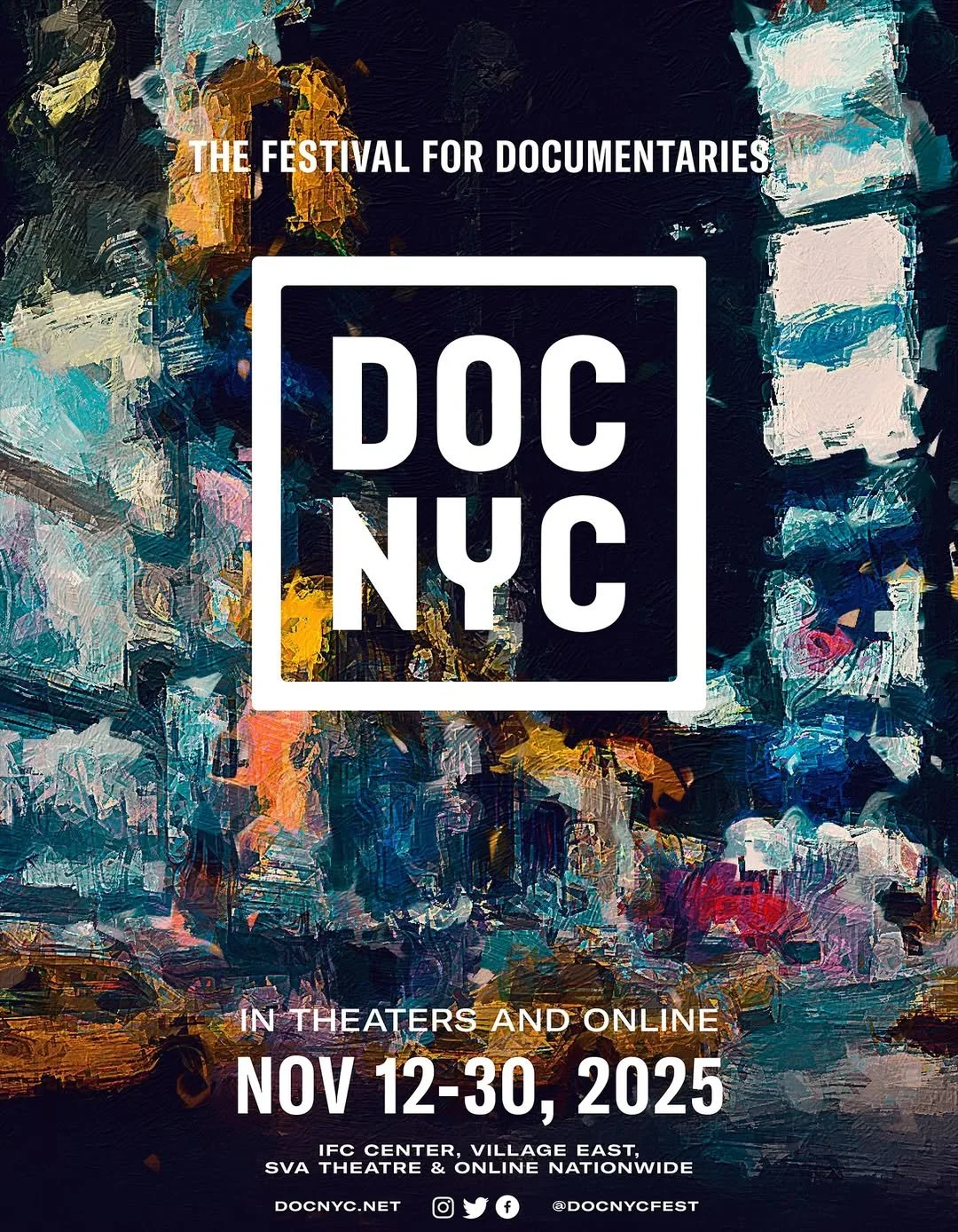 Person in a blue plaid jacket and black beret smiling indoors, holding a phone and microphone, with a lanyard around their neck. An artwork on the wall and another person in the background.