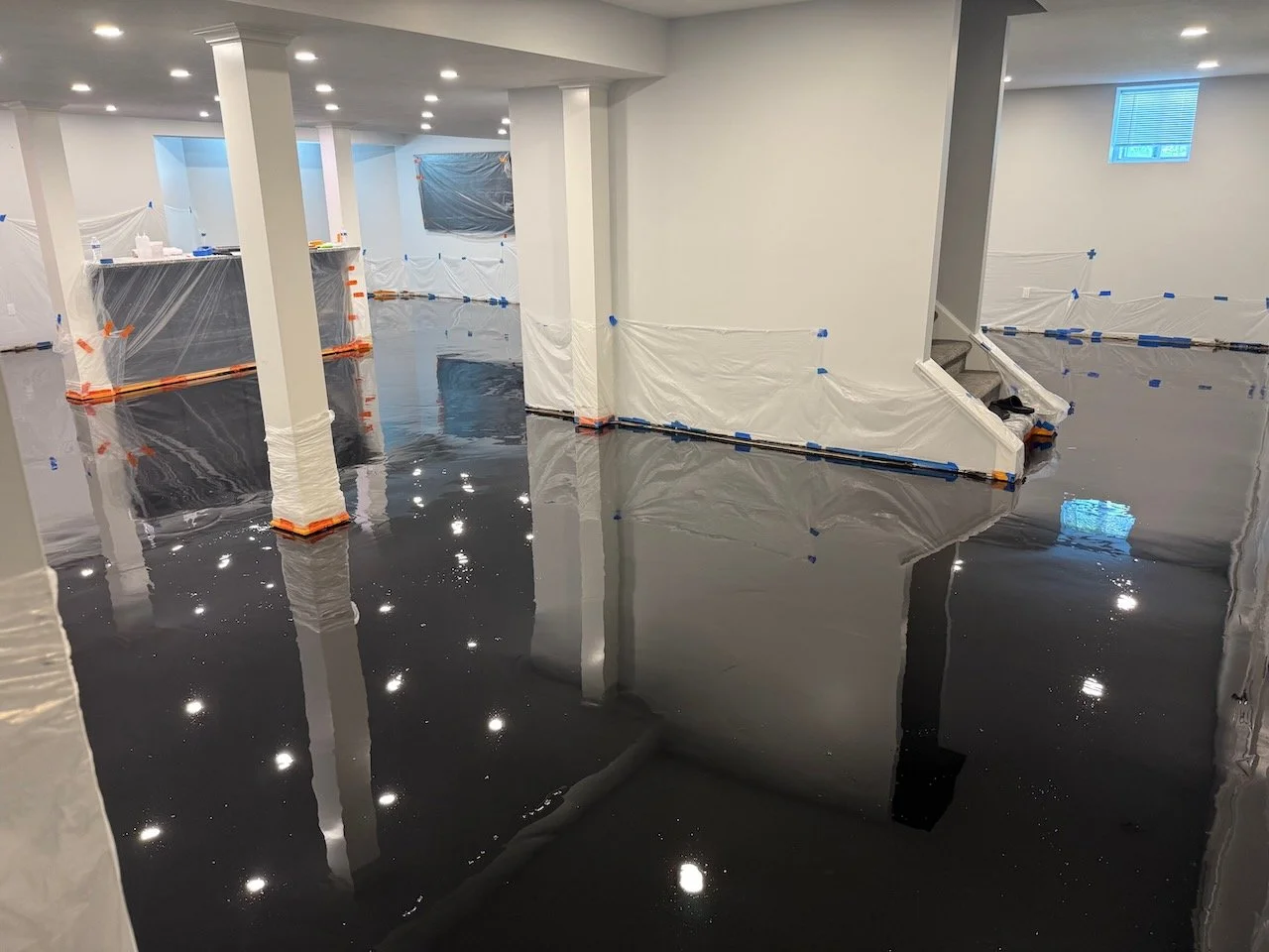 Professional epoxy floor coating application by NXT Level Concrete