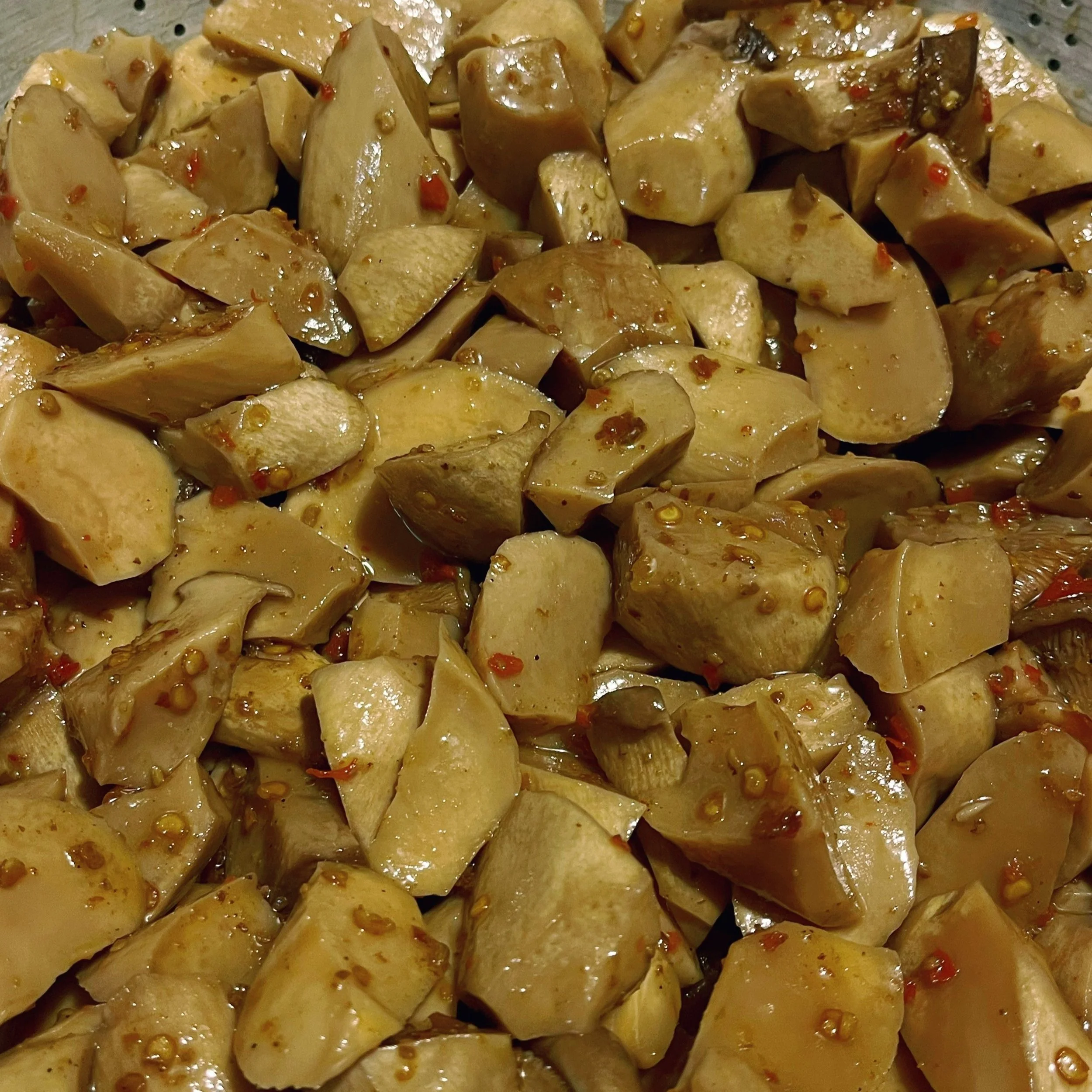 Close-up of chopped mushrooms in a sauce or marinade