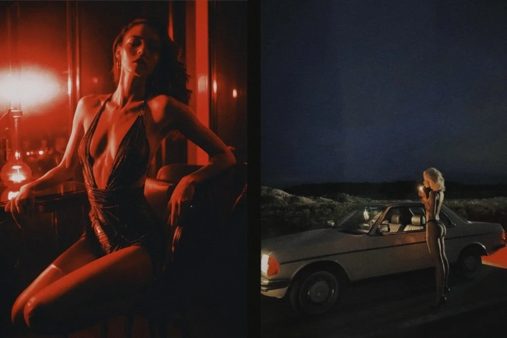 A woman in a revealing black dress stands next to a vintage car on a deserted road at night, illuminated by a streetlight, with a dark landscape in the background.