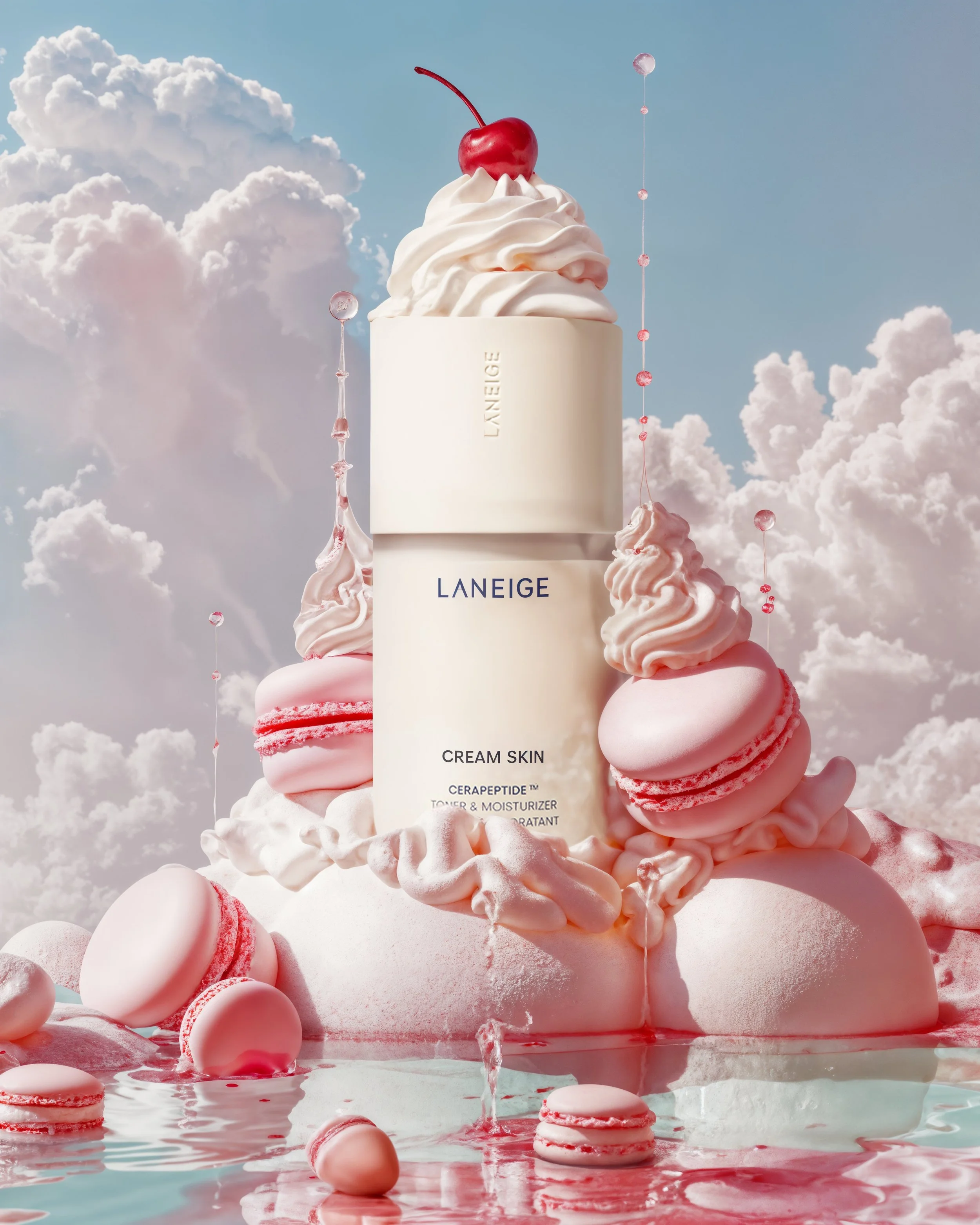 A bottle of Laneige Cream Skin displayed amid pink macarons, marshmallows, and whipped cream with a sky and fluffy clouds background.
