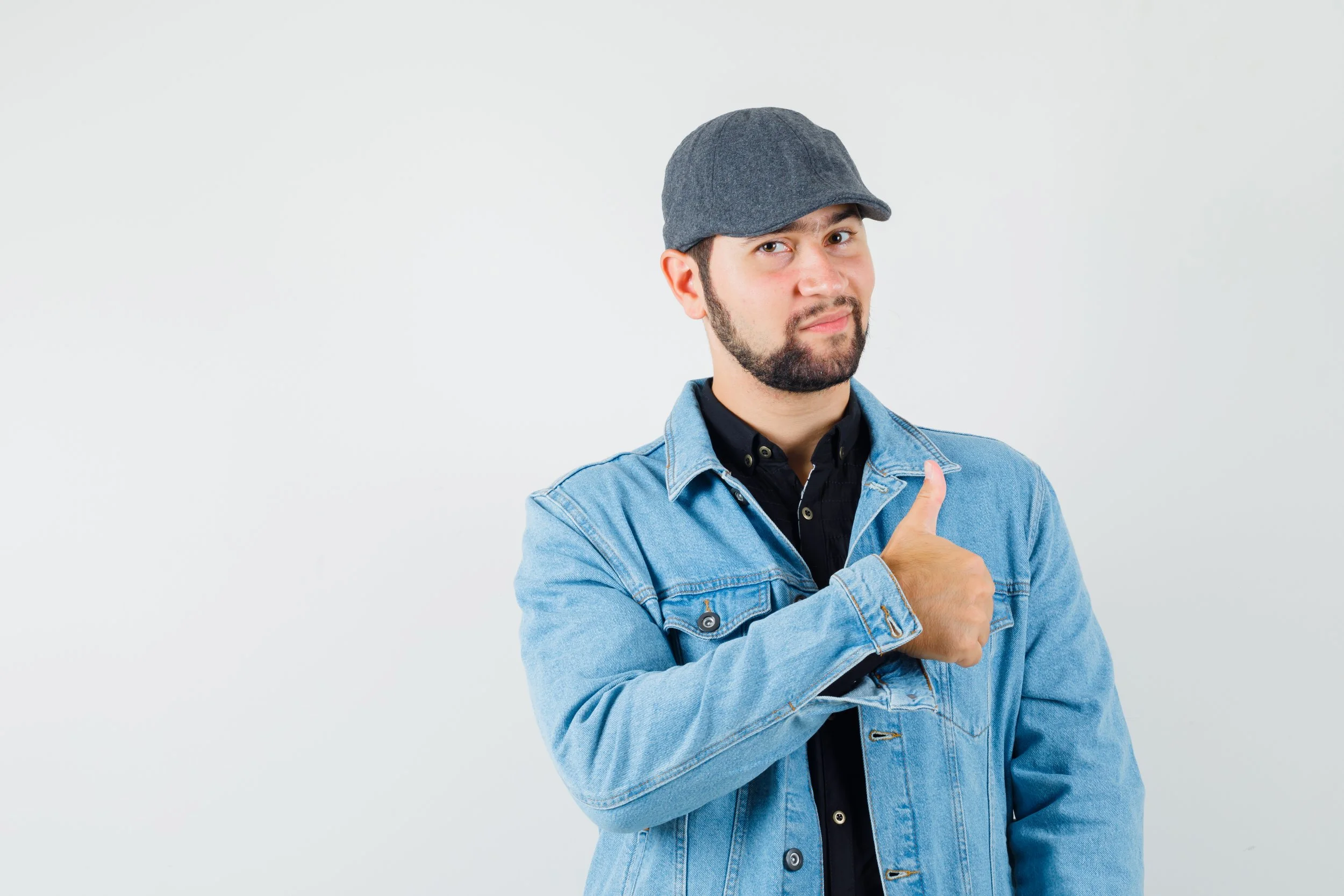 retro-style-man-showing-thumb-up-jacket-cap-looking-glad-front-view.jpg