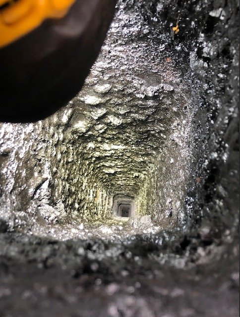 This is a good example of Type II creosote melting into Type III. It will resemble a sap like consistency when hot but harden like epoxy when cooled and very difficult to remove.