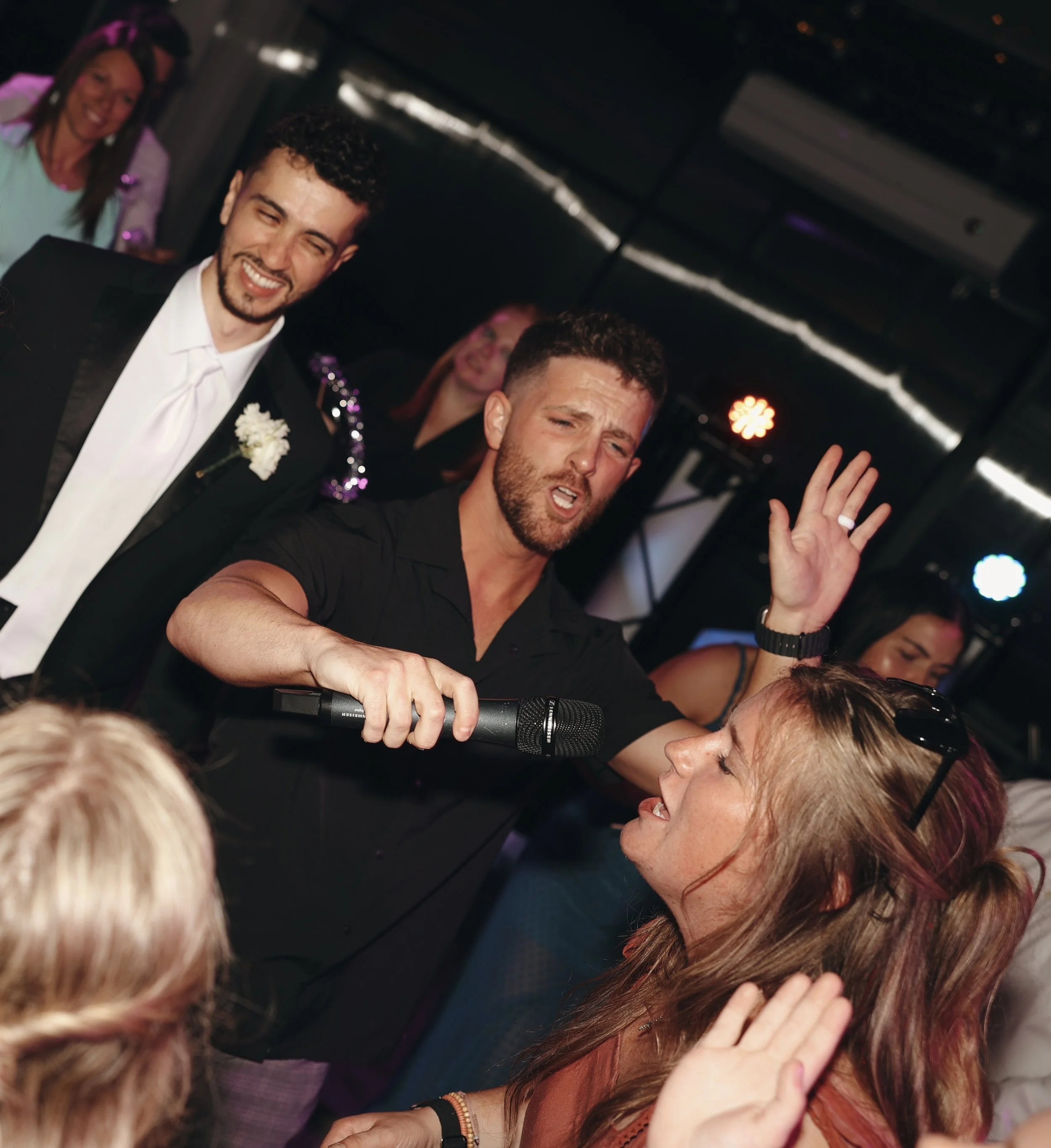 DJ Deno dancing with groom at wedding