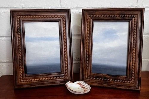 Dreamy oil paintings of a cloudy sky that intermingles with the sea below.