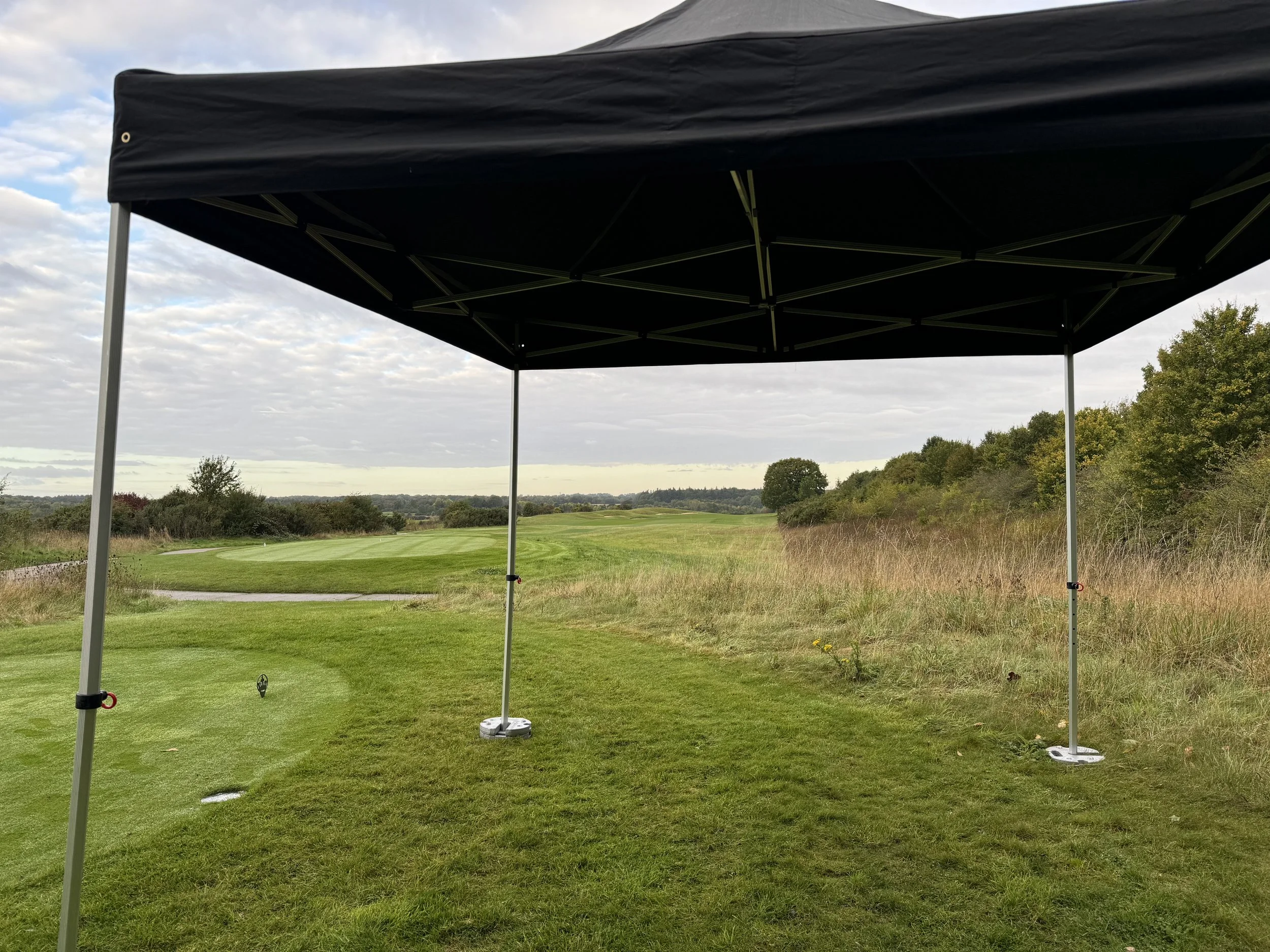Portable black canopy on a golf course with a view of a putting green and open landscape marquee hire
gazebo hire
party tent hire
party marquee hire
event tent hire
wedding marquee hire
pop up gazebo hire
corporate event tent hire