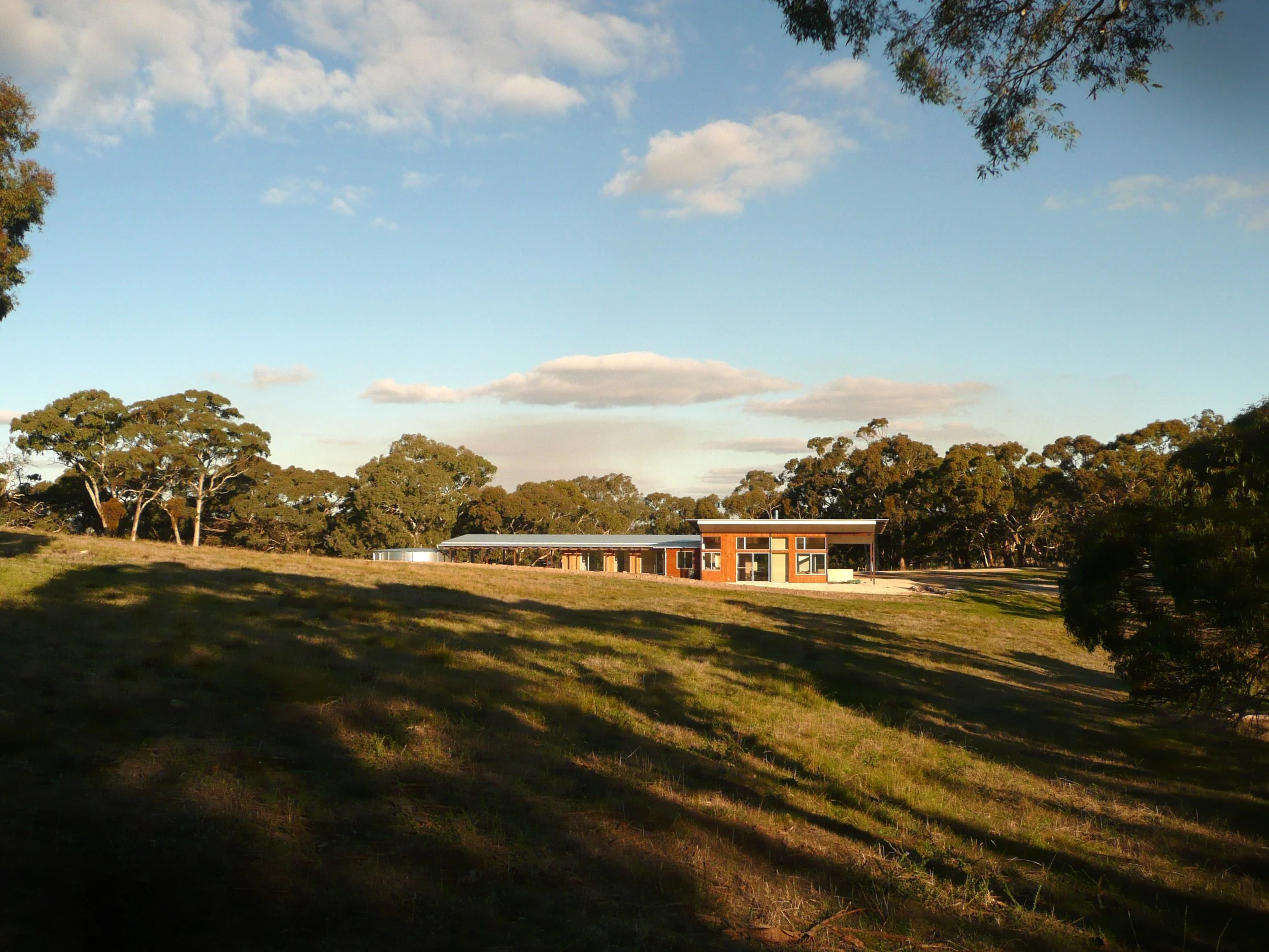 Medium distance view of a modern flat and long single levelled residential house surrounded by a large property in the Clare Valley