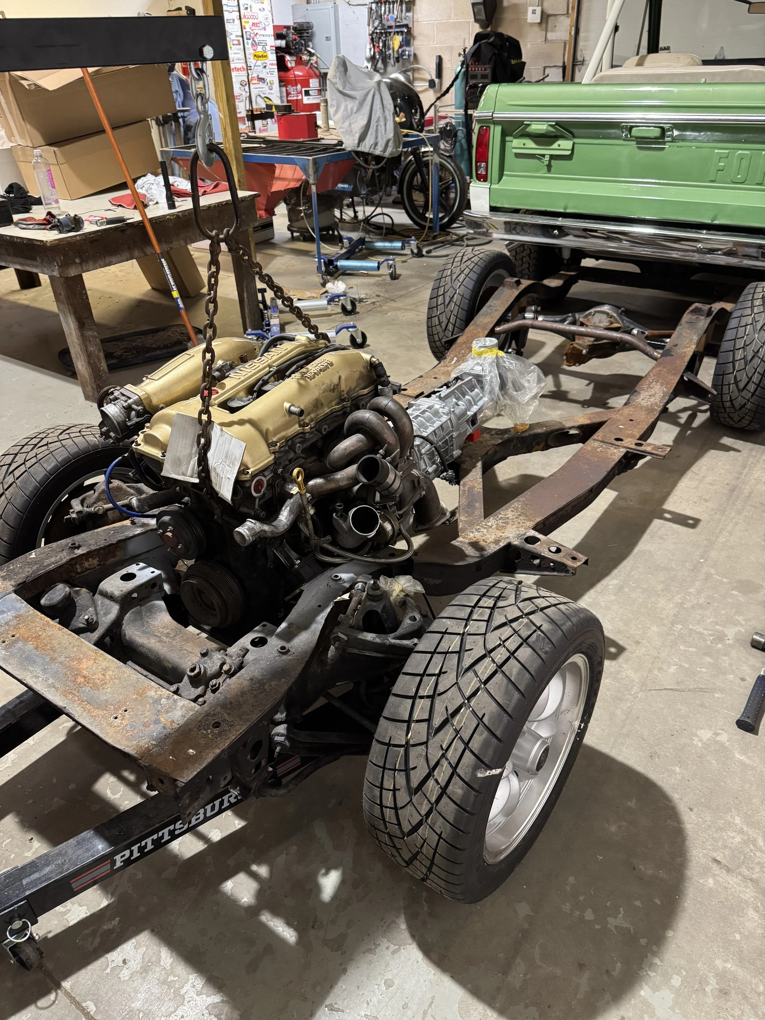 Mocking the drivetrain into the chassis verifies steering clearance, transmission fitment, and available space for the turbocharger, exhaust manifold, and supporting systems.