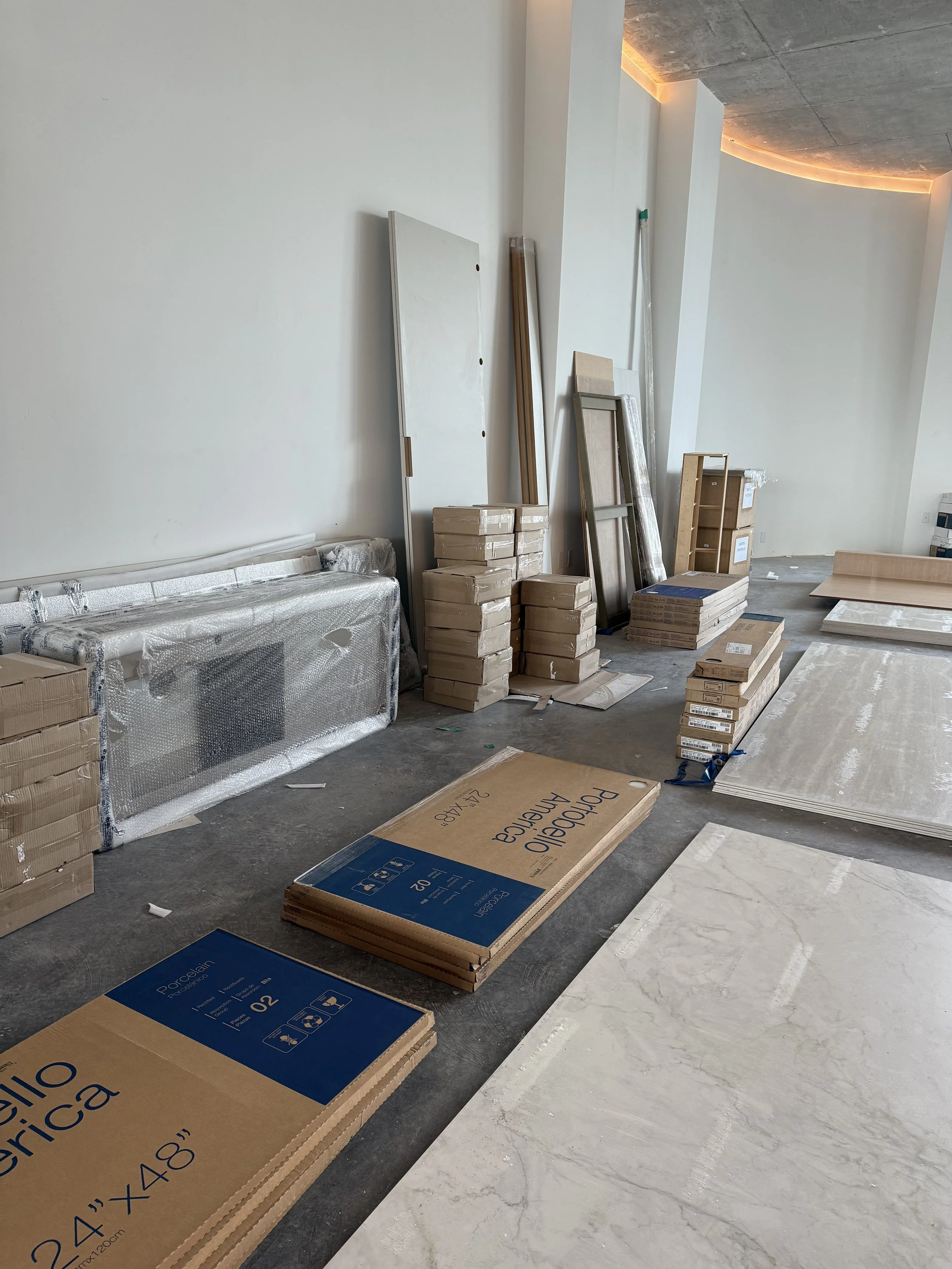Organized showroom staging with tile and materials during large-scale commercial moving project in Miami