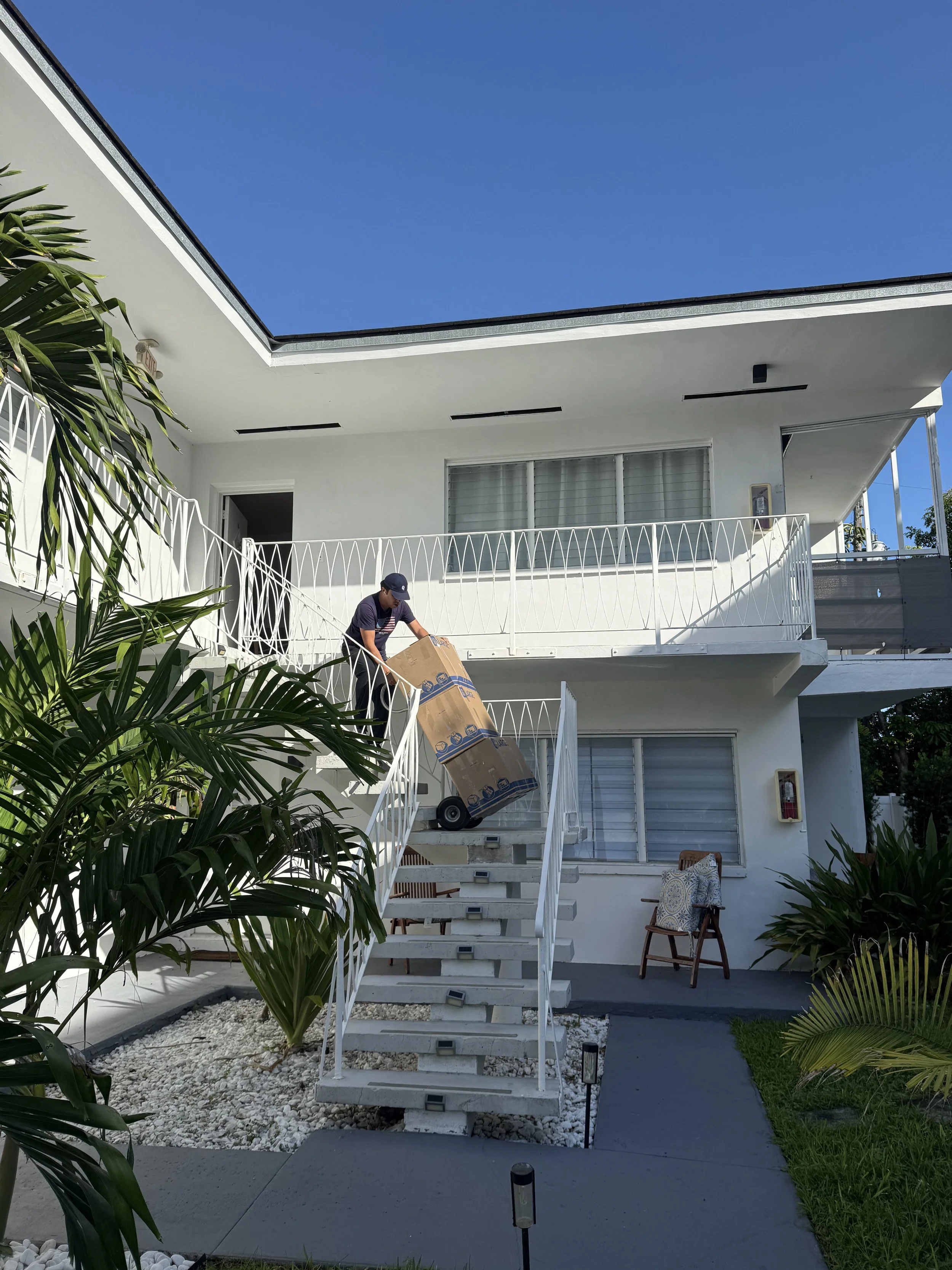 Biscayne Moving Co. mover working during a local move in Sunny Isles Beach, Florida, assisting with packing and loading. Professional South Florida movers providing white-glove moving services for high-rise condos and residential relocations.
