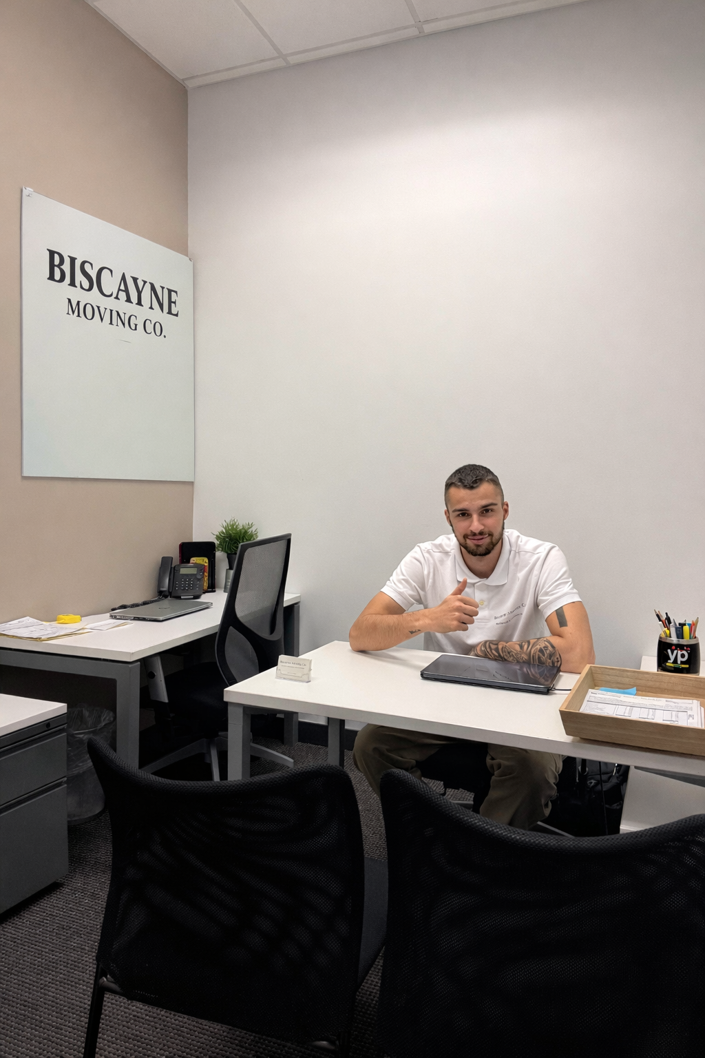 Biscayne Moving Co employee in uniform at Fort Lauderdale office