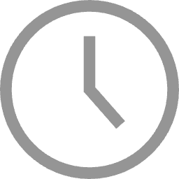 A simple black and gray wall clock showing the time as 3:00.