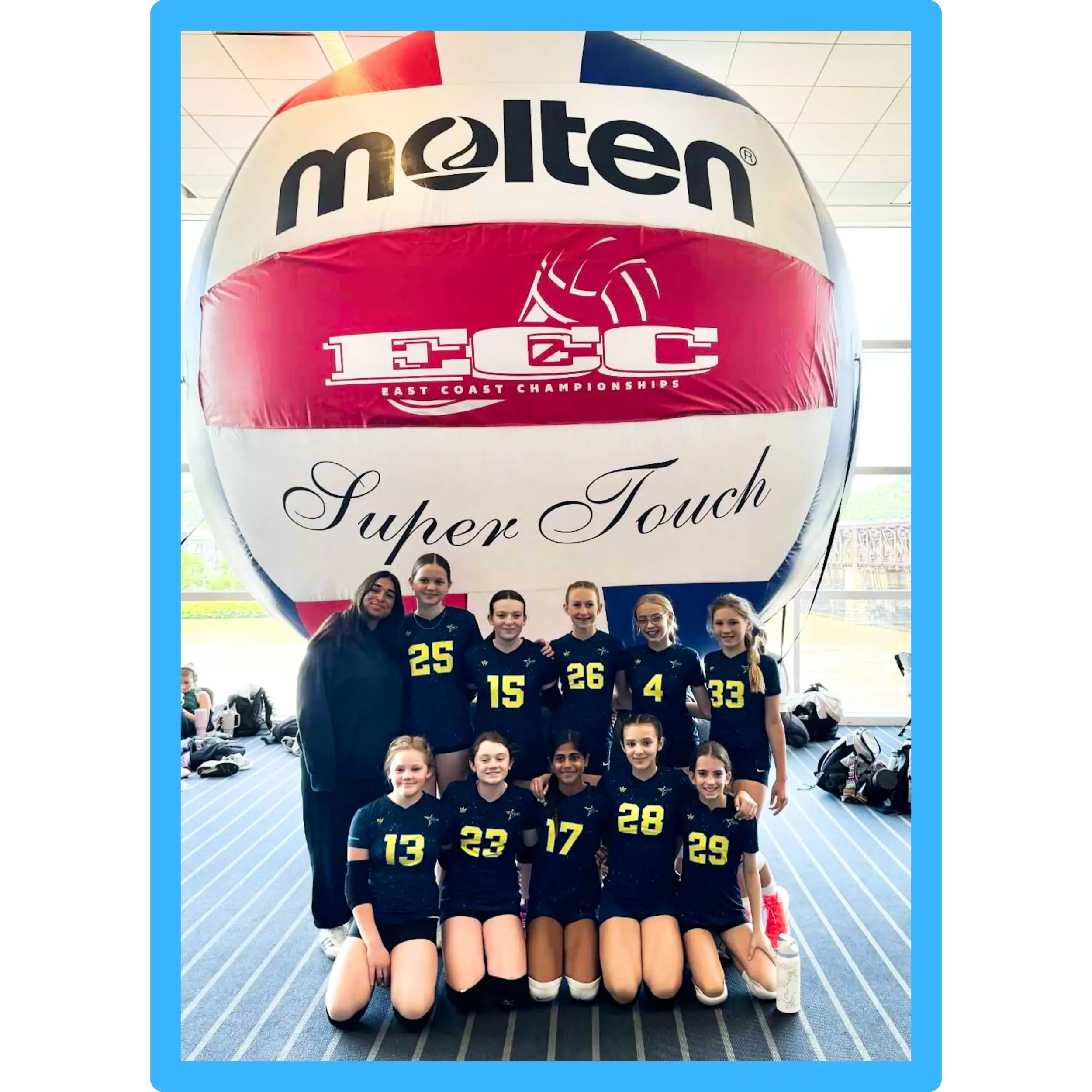 TCP Academy girls volleyball team poses in front of giant Molten ball at East Coast Championships, highlighting youth athletic excellence, tournament experience, and team pride