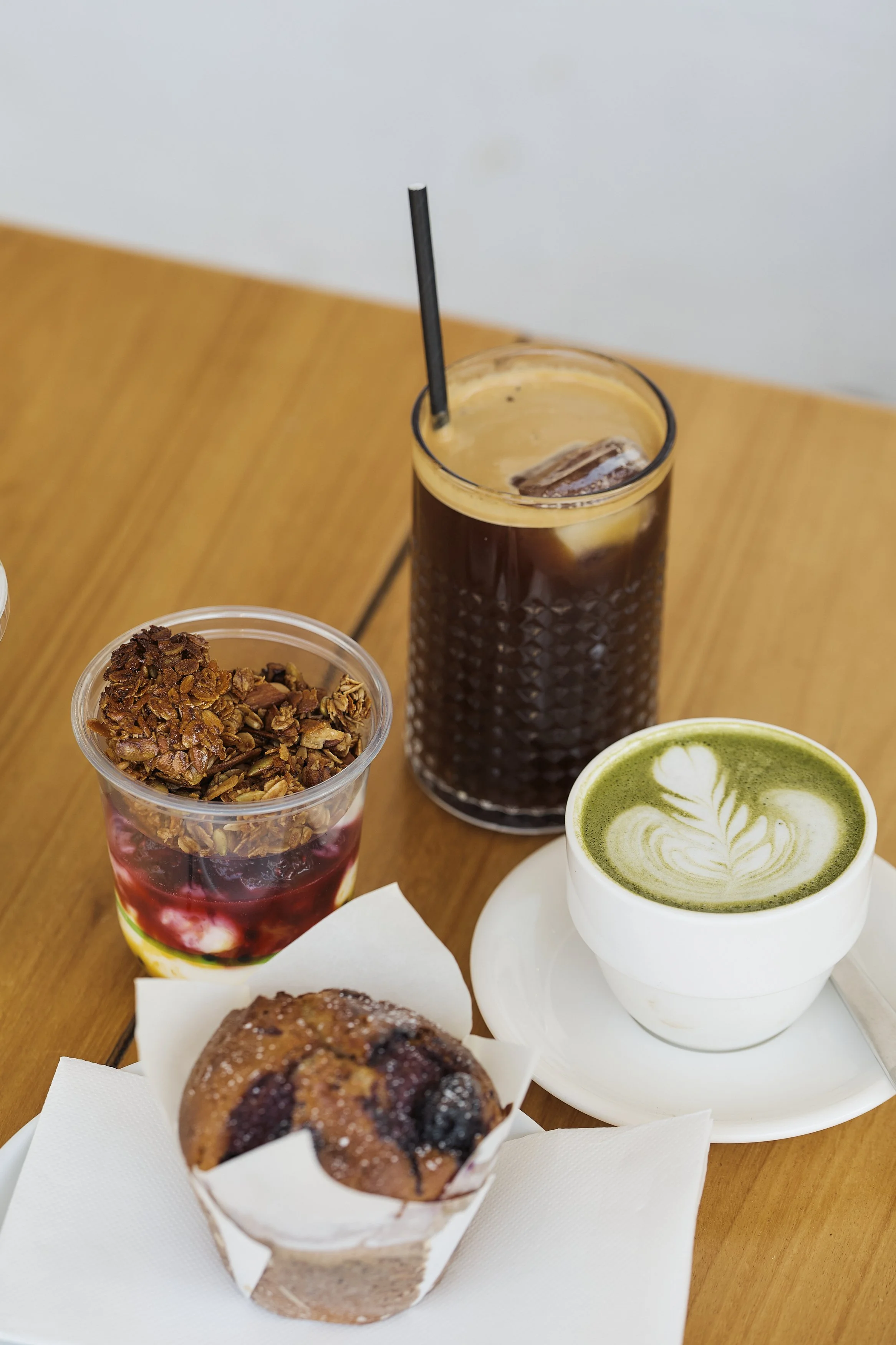 Food and coffee table setting at Dose Hospitality George Oyster Bay café in southern Sydney