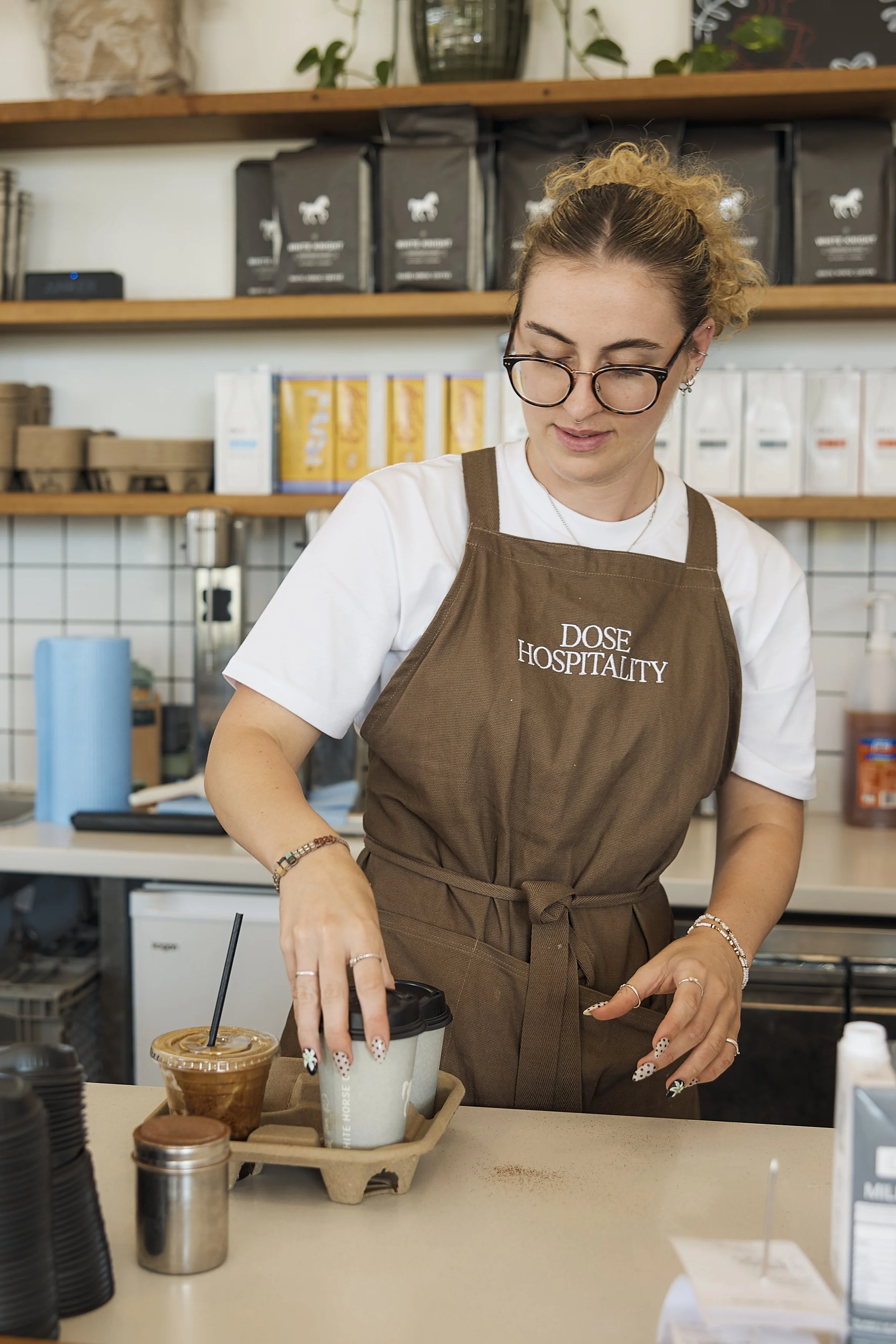 Dose Engadine barista preparing fresh coffee at the café in southern Sydney