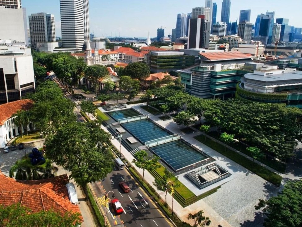 Reflection Pool Skylight, Bras Basah, Singapore | Peter Lalas was the façade consultant for this project from concept through to completion. The glass skylight at ground-level, situated over an underground railway station (Singapore MRT) supports 75m
